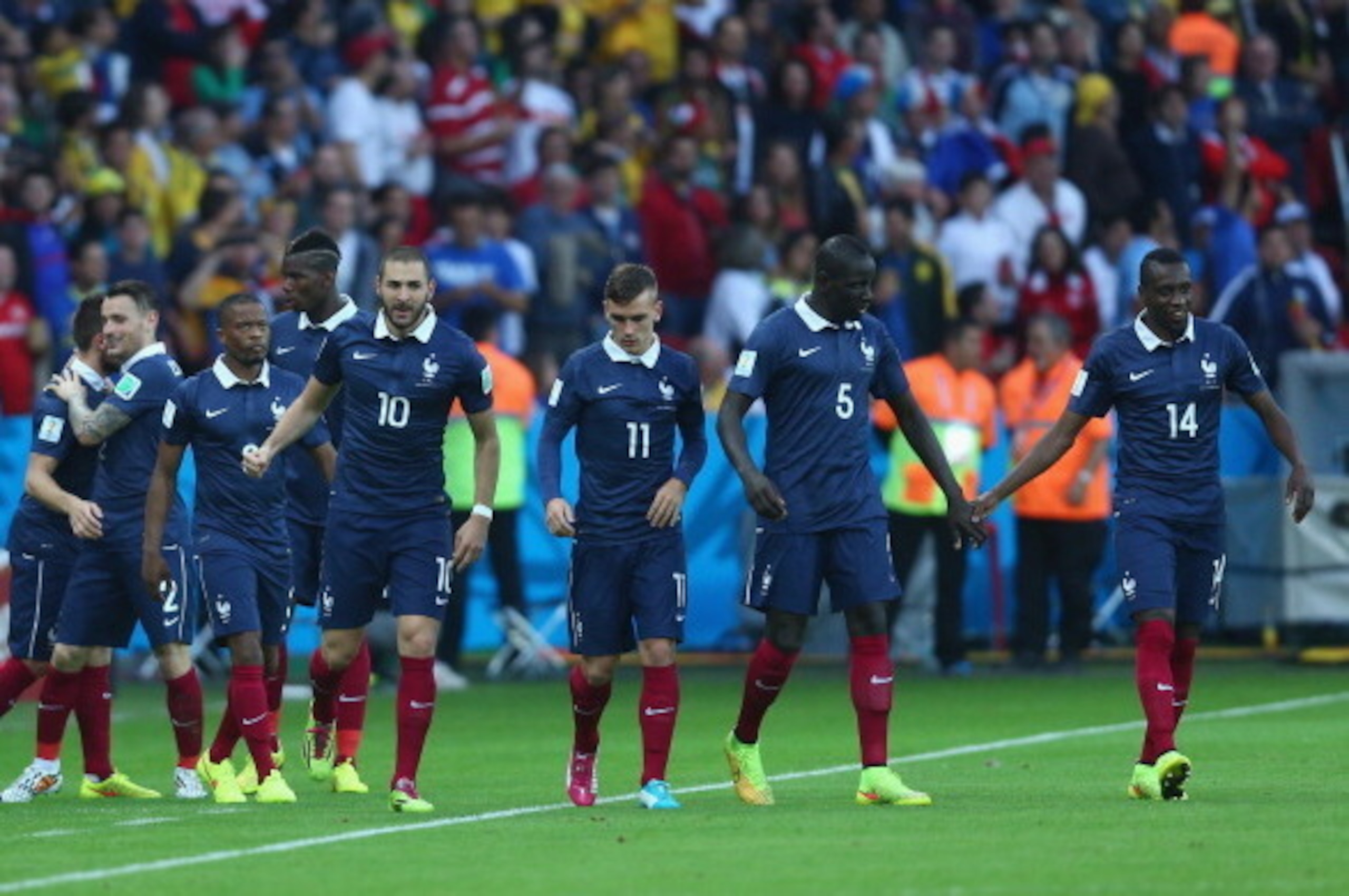 PORTO ALEGRE, BRAZIL - JUNE 15: Karim Benzema of France (10) celebrates with teammates after their second goal during the 2014 FIFA World Cup Brazil Group E match between France and Honduras at Estadio Beira-Rio on June 15, 2014 in Porto Alegre, Brazil. PORTO ALEGRE, BRAZIL - JUNE 15: Karim Benzema of France (10) celebrates with teammates after their second goal during the 2014 FIFA World Cup Brazil Group E match between France and Honduras at Estadio Beira-Rio on June 15, 2014 in Porto Alegre, Brazil.