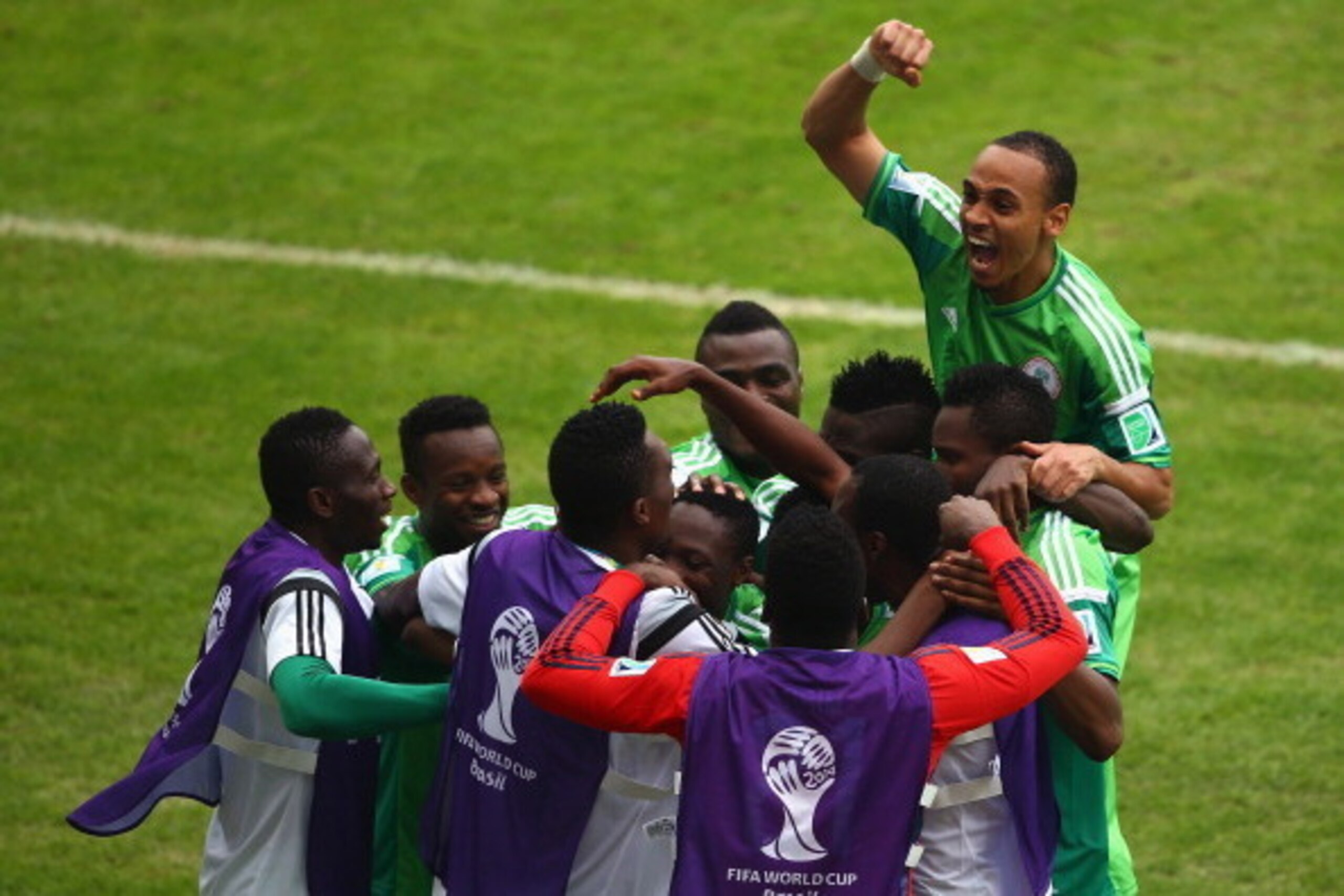 PORTO ALEGRE, BRAZIL - JUNE 25: Ahmed Musa of Nigeria celebrates with teammates after scoring his team's second goal and his second of the game during the 2014 FIFA World Cup Brazil Group F match between Nigeria and Argentina at Estadio Beira-Rio on June PORTO ALEGRE, BRAZIL - JUNE 25: Ahmed Musa of Nigeria celebrates with teammates after scoring his team's second goal and his second of the game during the 2014 FIFA World Cup Brazil Group F match between Nigeria and Argentina at Estadio Beira-Rio on June