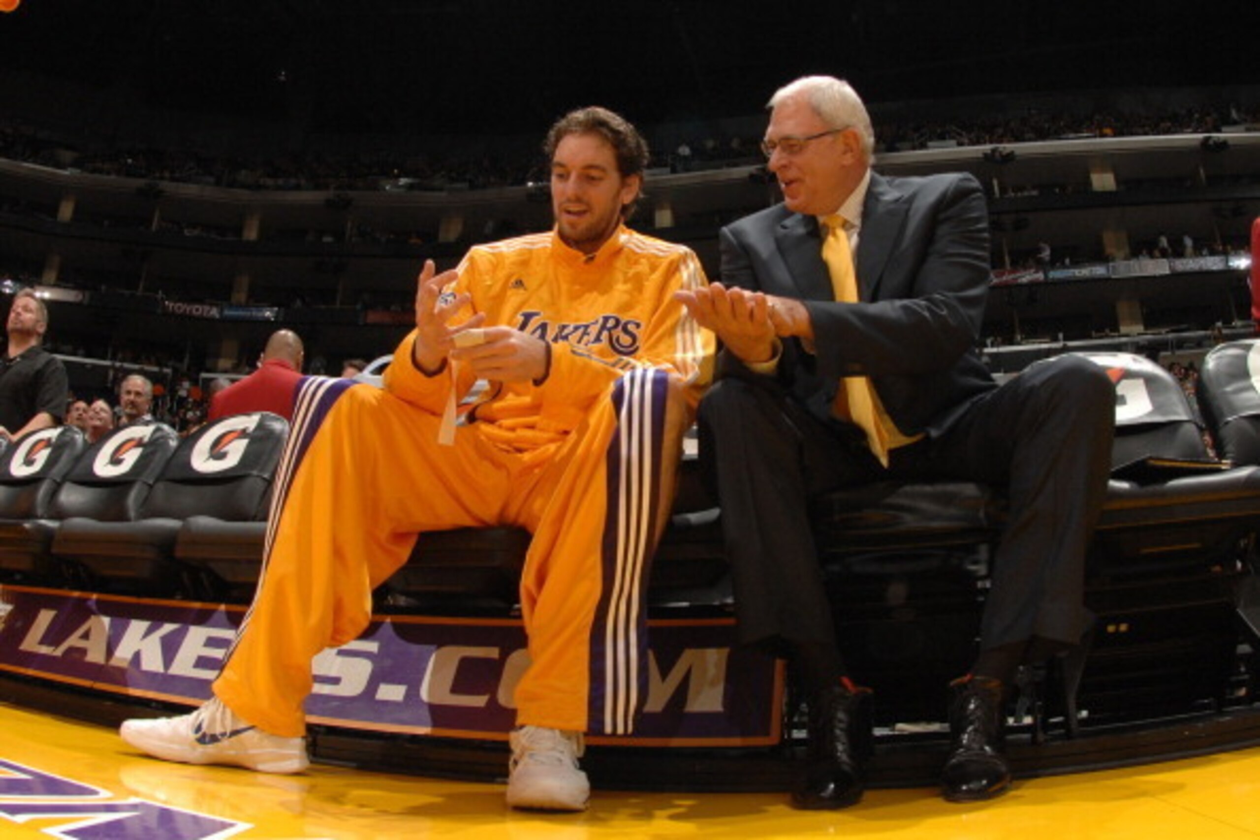 LOS ANGELES - NOVEMBER 9:  Pau Gasol #16 and Head Coach Phil Jackson of the Los Angeles Lakers share a few words on the bench before their game against the Minnesota Timberwolves at Staples Center on November 9, 2010 in Los Angeles, California. NOTE TO US