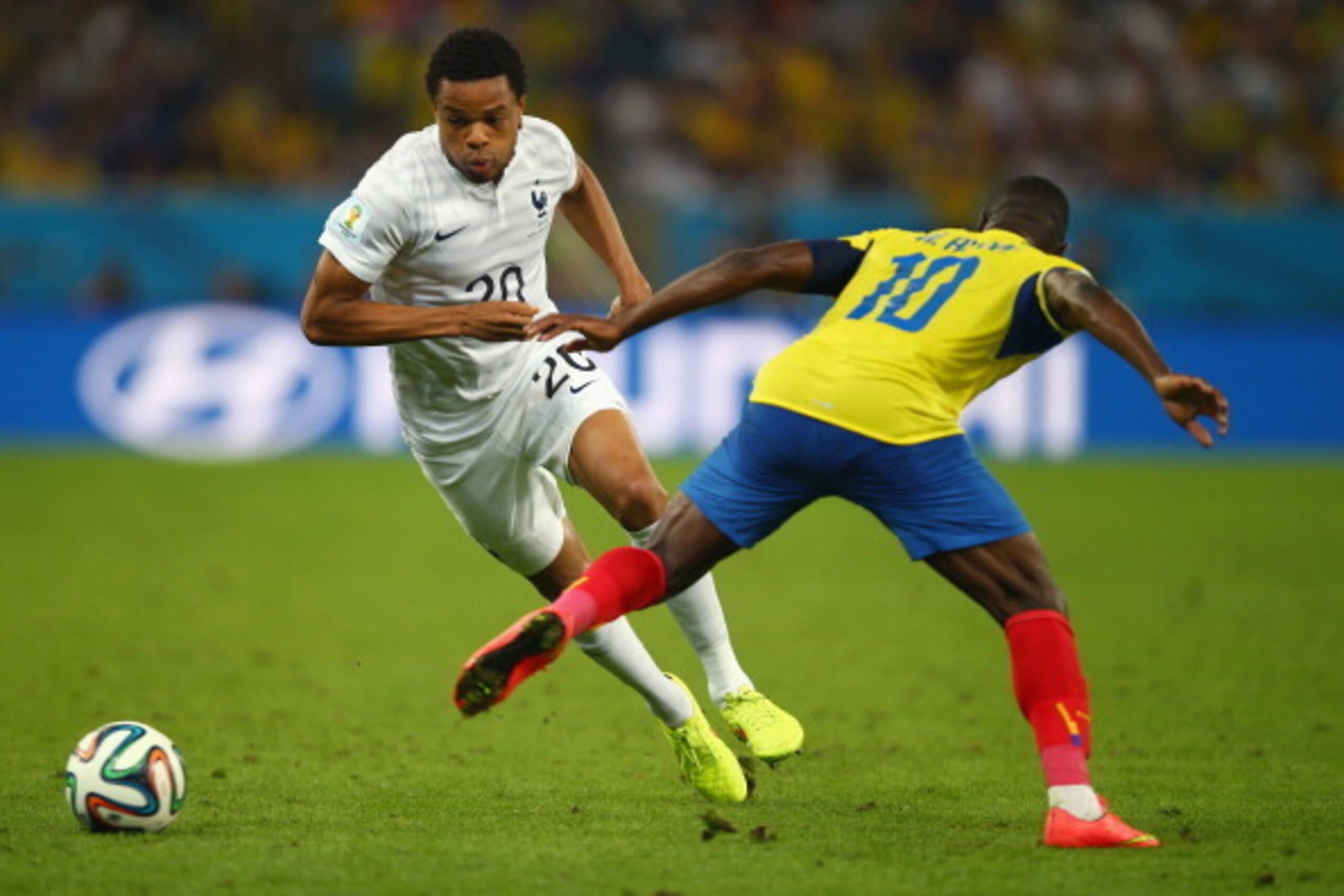 RIO DE JANEIRO, BRAZIL - JUNE 25: Loic Remy of France competes for the ball with Walter Ayovi of Ecuador during the 2014 FIFA World Cup Brazil Group E match between Ecuador and France at Maracana on June 25, 2014 in Rio de Janeiro, Brazil.  (Photo by Cliv