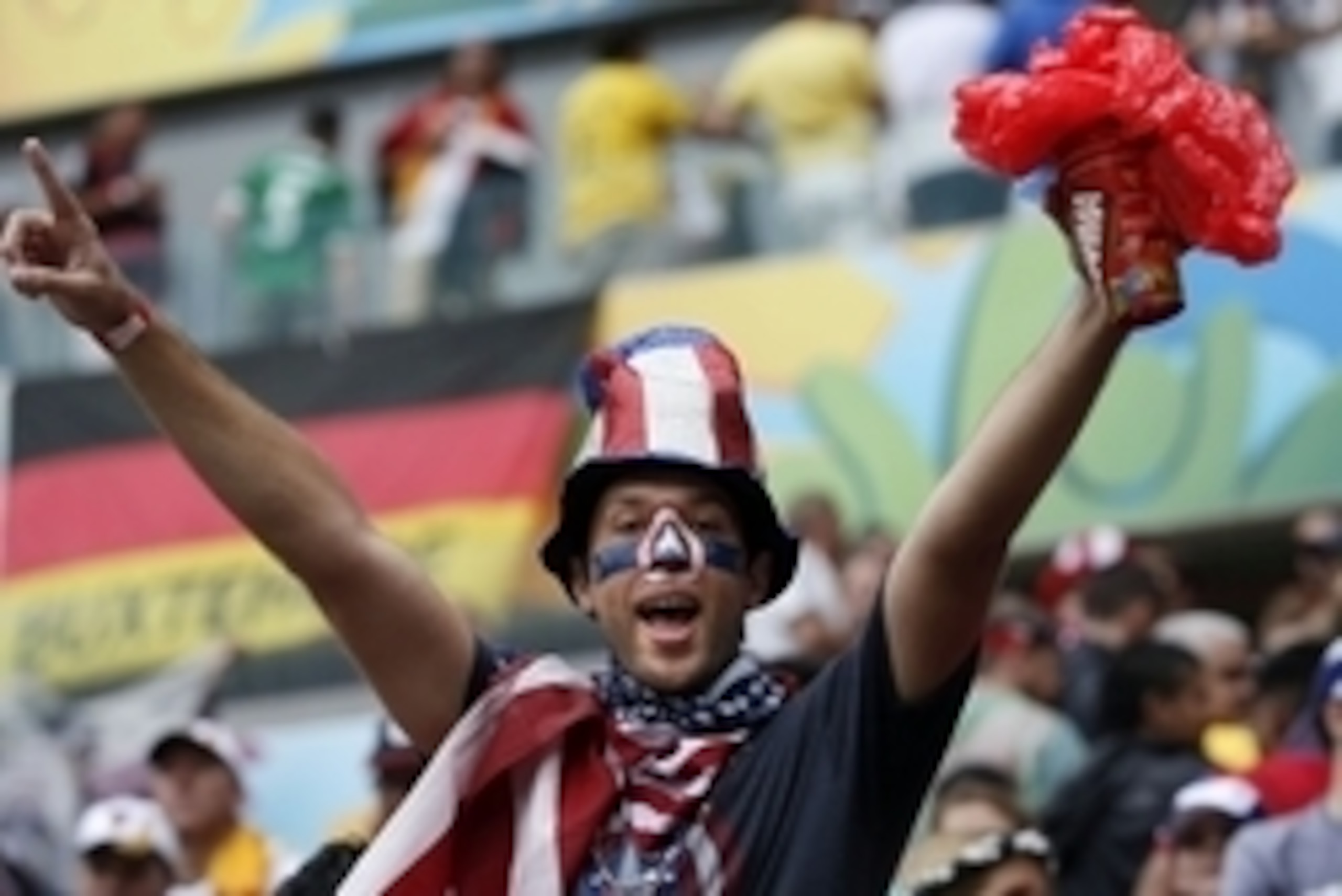 Jun 26, 2014; Recife, BRAZIL; A United States fan celebrates after finding out they had advanced past the group stage after their 1-0 loss to Germany at Arena Pernambuco. Mandatory Credit: Winslow Townson-USA TODAY Sports