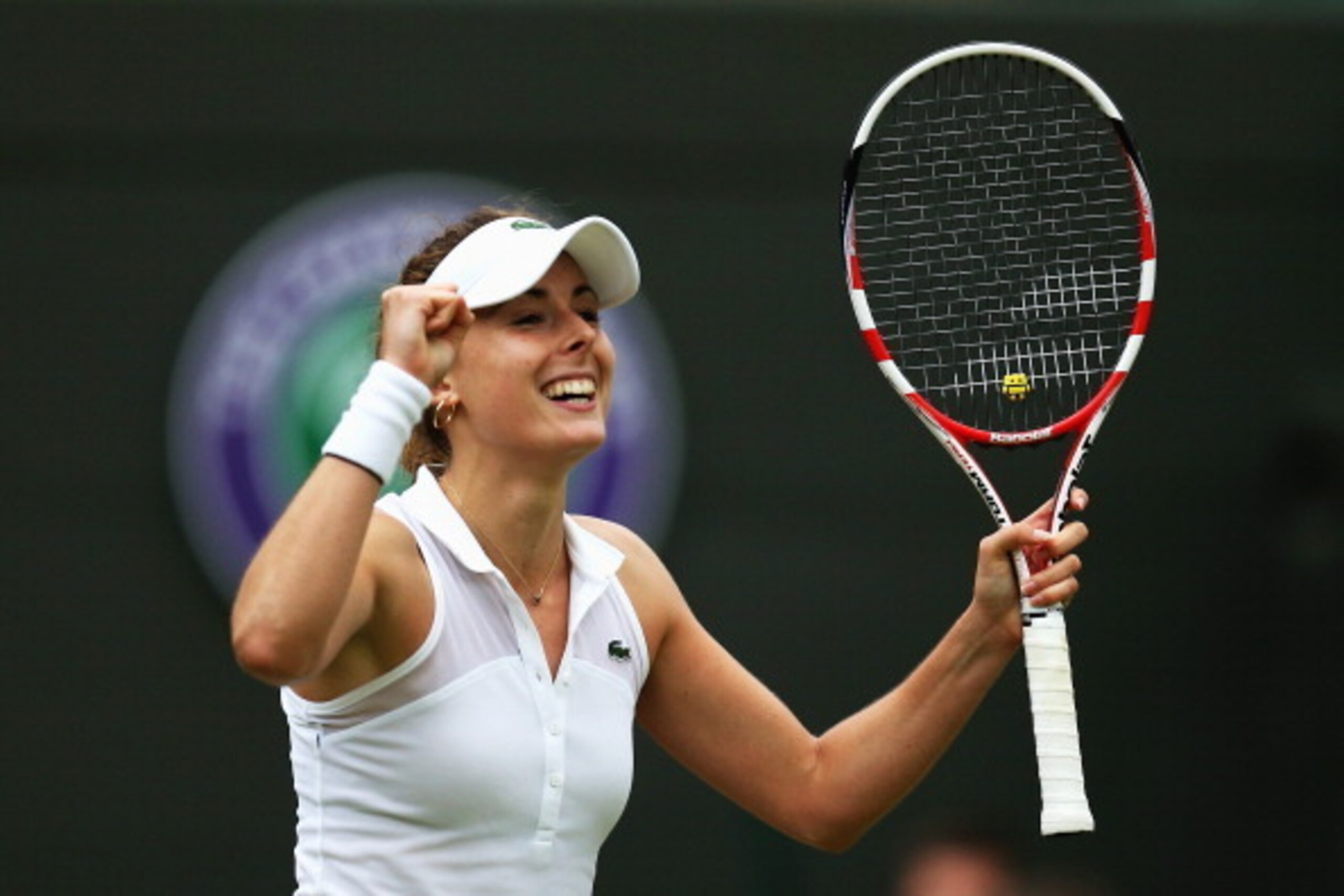LONDON, ENGLAND - JUNE 28:  Alize Cornet of France celebrates after winning her Ladies' Singles third round match against Serena Williams of the United States on day six of the Wimbledon Lawn Tennis Championships at the All England Lawn Tennis and Croquet