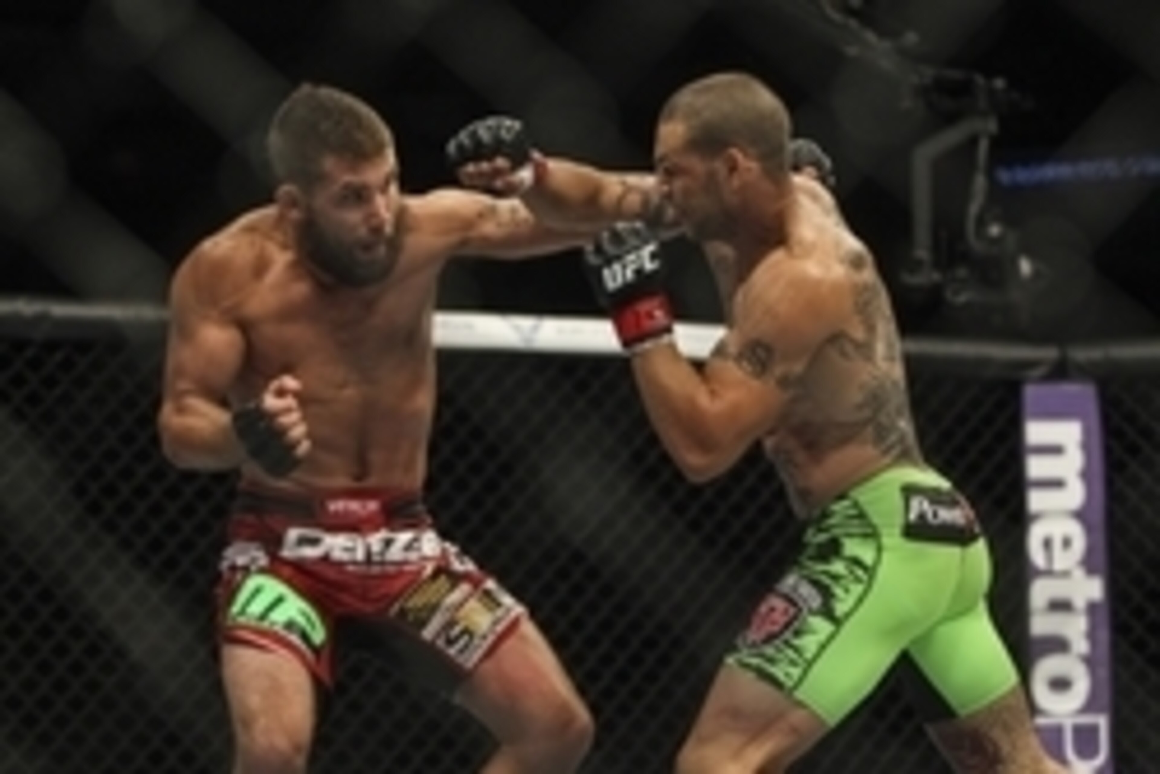 Jun 28, 2014; San Antonio, TX, USA; Cub Swanson (red gloves) fights Jeremy Stephens (blue gloves) in a Featherweight bout at UFC Fight Night 43 at AT&T Center. Mandatory Credit: Troy Taormina-USA TODAY Sports