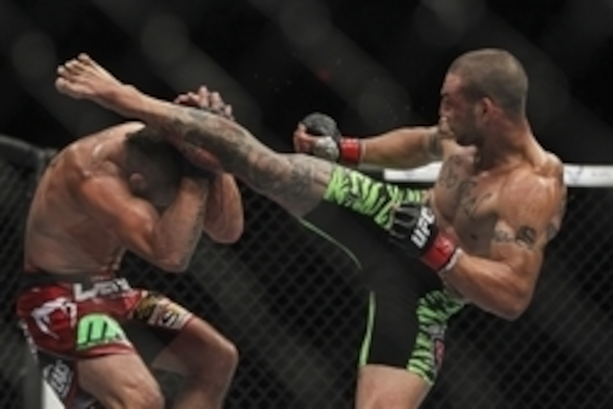 Jun 28, 2014; San Antonio, TX, USA; Cub Swanson (red gloves) fights Jeremy Stephens (blue gloves) in a Featherweight bout at UFC Fight Night 43 at AT&T Center. Mandatory Credit: Troy Taormina-USA TODAY Sports