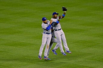 DENVER, CO - JUNE 6:  Matt Kemp #27, Yasiel Puig #66 and Andre Ethier #16 of the Los Angeles Dodgers celebrate their 7-2 win against the Colorado Rockies at Coors Field on June 6, 2014 in Denver, Colorado. (Photo by Justin Edmonds/Getty Images)
