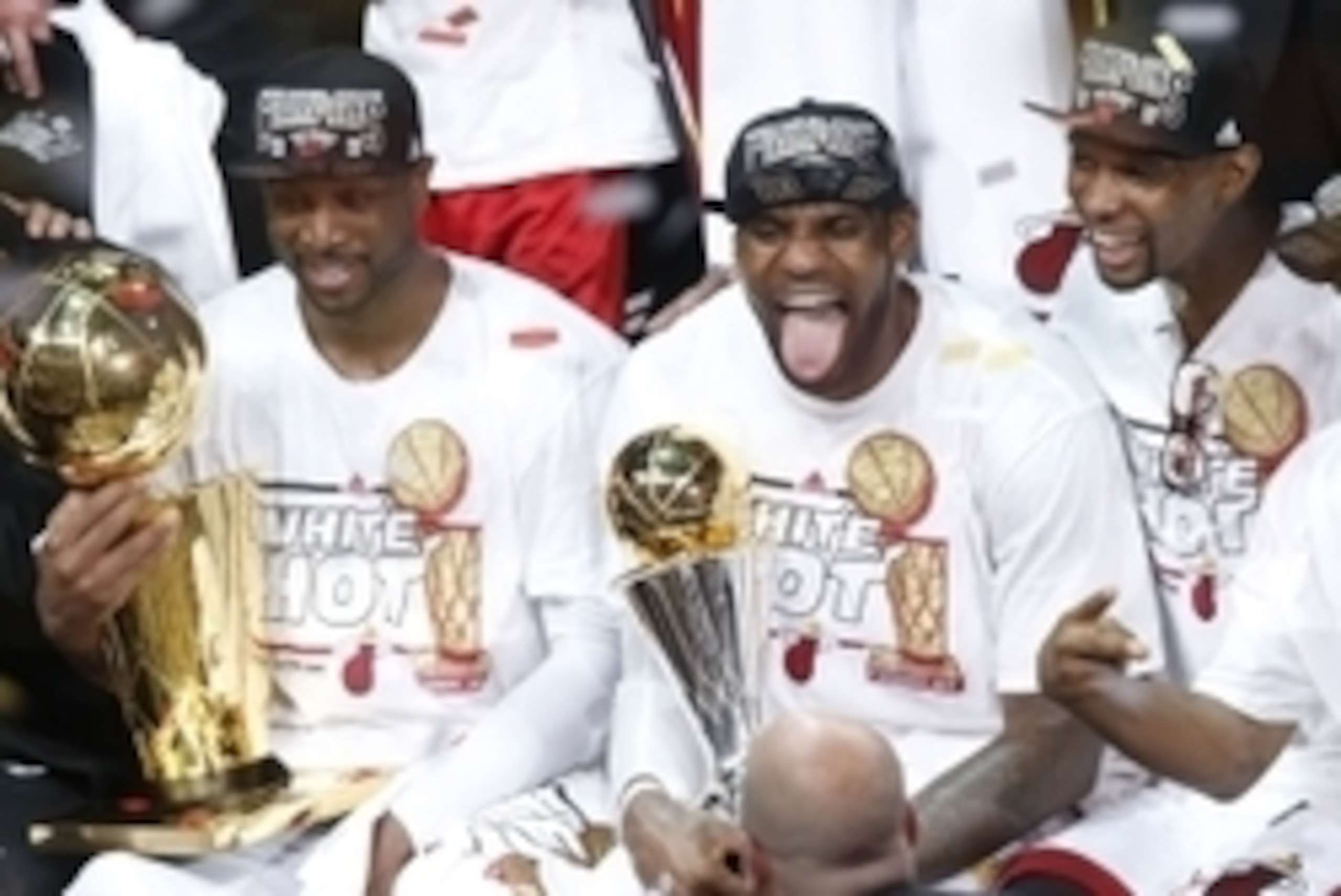 Jun 20, 2013; Miami, FL, USA; Miami Heat shooting guard Dwyane Wade (left), LeBron James (center) and Chris Bosh (right) celebrate after game seven in the 2013 NBA Finals at American Airlines Arena. Miami defeated the San Antonio Spurs 95-88 to win the NB