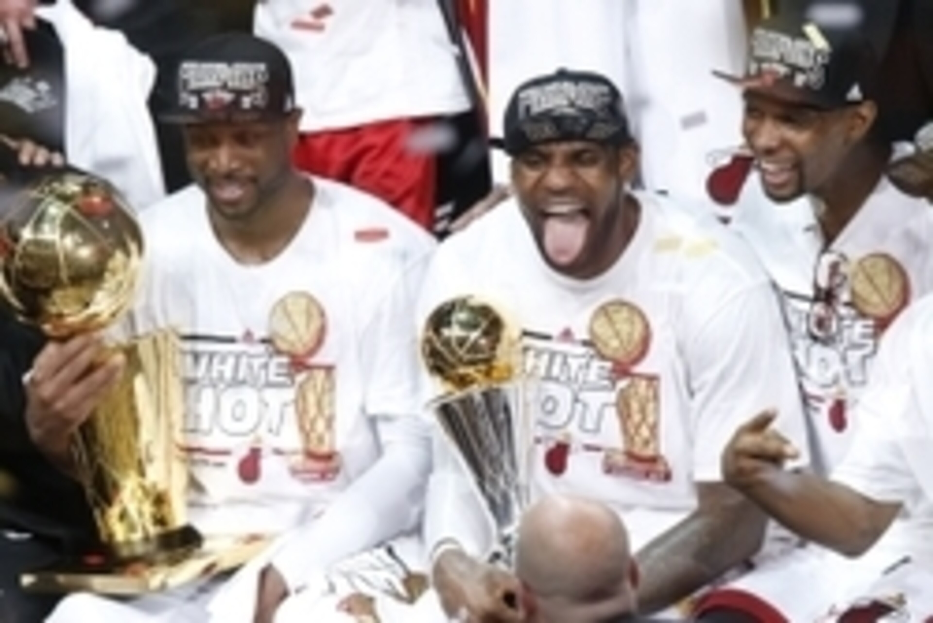 Jun 20, 2013; Miami, FL, USA; Miami Heat shooting guard Dwyane Wade (left), LeBron James (center) and Chris Bosh (right) celebrate after game seven in the 2013 NBA Finals at American Airlines Arena. Miami defeated the San Antonio Spurs 95-88 to win the NB
