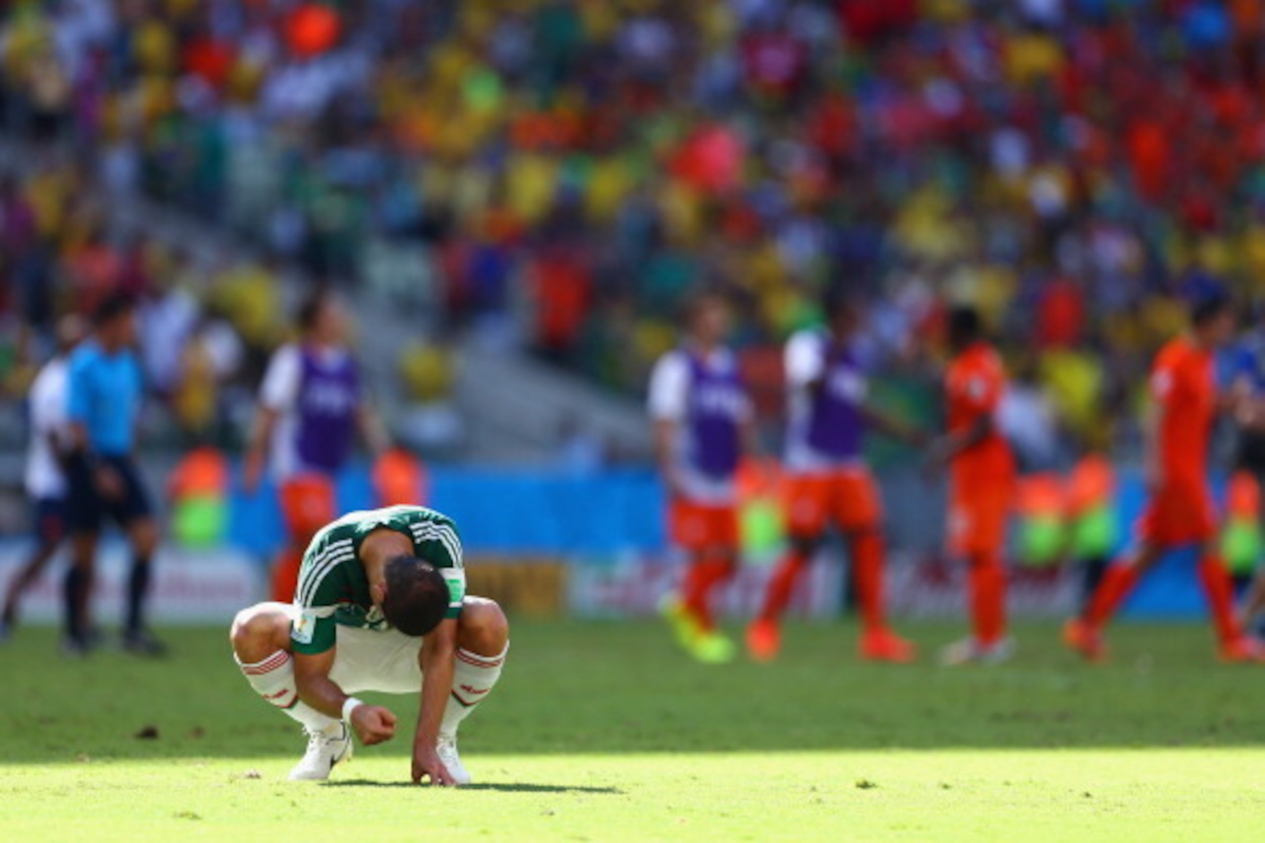 FORTALEZA, BRAZIL - JUNE 29:  A dejected Javier Hernandez of Mexico looks on after being defeated by the Netherlands 2-1 during the 2014 FIFA World Cup Brazil Round of 16 match between Netherlands and Mexico at Castelao on June 29, 2014 in Fortaleza, Braz