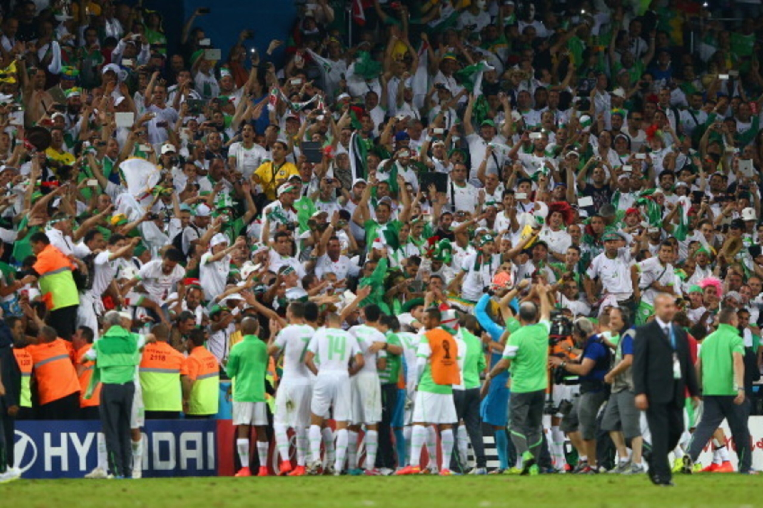 CURITIBA, BRAZIL - JUNE 26: Algeria acknowledge the fans after a 1-1 draw during the 2014 FIFA World Cup Brazil Group H match between Algeria and Russia at Arena da Baixada on June 26, 2014 in Curitiba, Brazil.  (Photo by Jamie Squire/Getty Images)