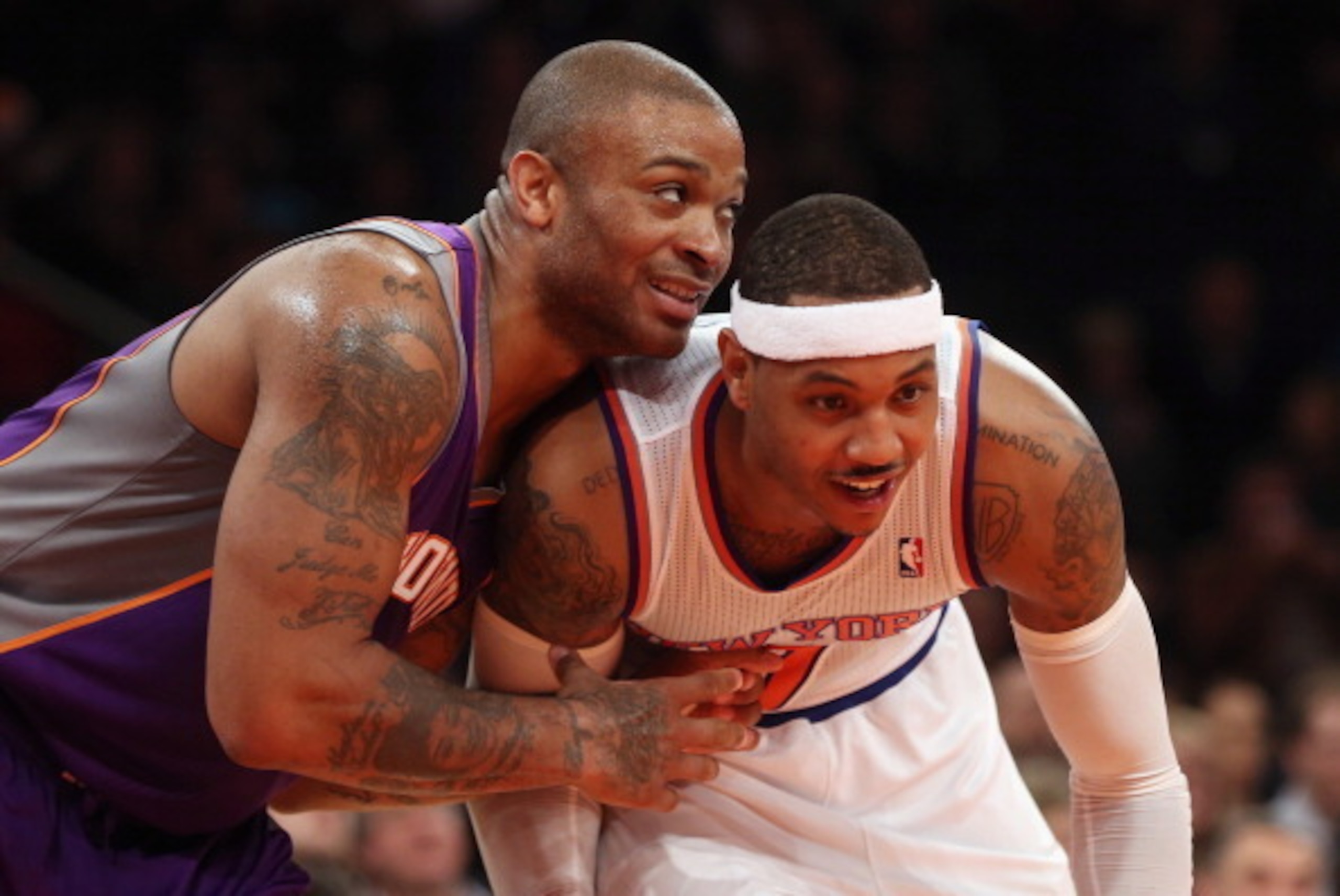 NEW YORK, NY - DECEMBER 02:  Carmelo Anthony #7 of the New York Knicks and P.J. Tucker #17 of the Phoenix Suns jockey for position at Madison Square Garden on December 2, 2012 in New York City. NOTE TO USER: User expressly acknowledges and agrees that, by