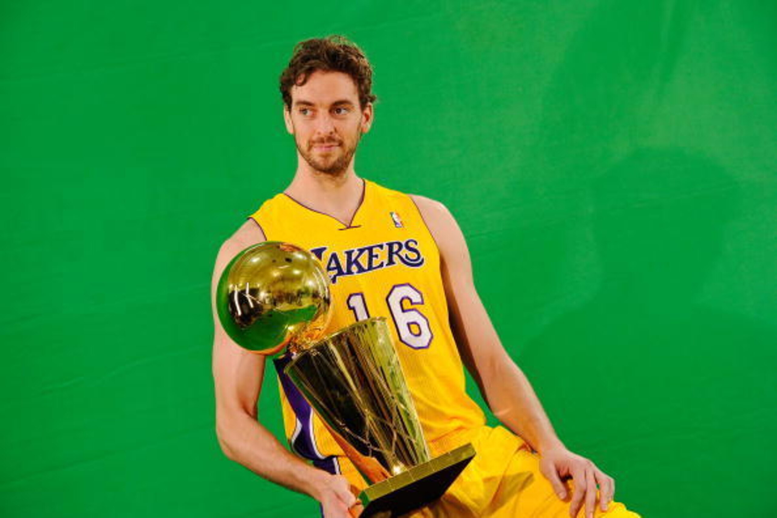 EL SEGUNDO, CA - SEPTEMBER 25:  Pau Gasol #16 of the Los Angeles Lakers poses for a photograph with the NBA Finals Larry O'Brien Championship Trophy during Media Day at the Toyota Center on September 25, 2010 in El Segundo, California. NOTE TO USER: User 