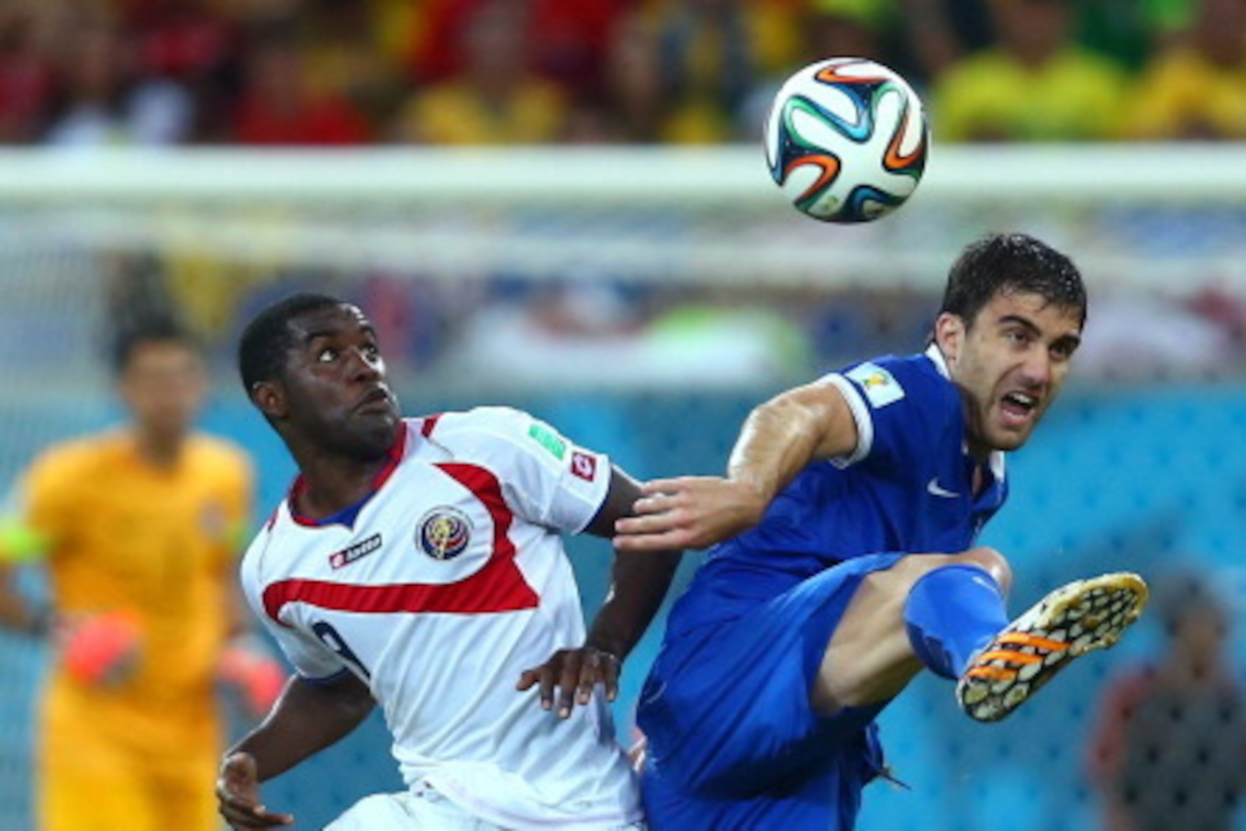 RECIFE, BRAZIL - JUNE 29: Joel Campbell of Costa Rica challenges Sokratis Papastathopoulos of Greece during the 2014 FIFA World Cup Brazil Round of 16 match between Costa Rica and Greece at Arena Pernambuco on June 29, 2014 in Recife, Brazil.  (Photo by J