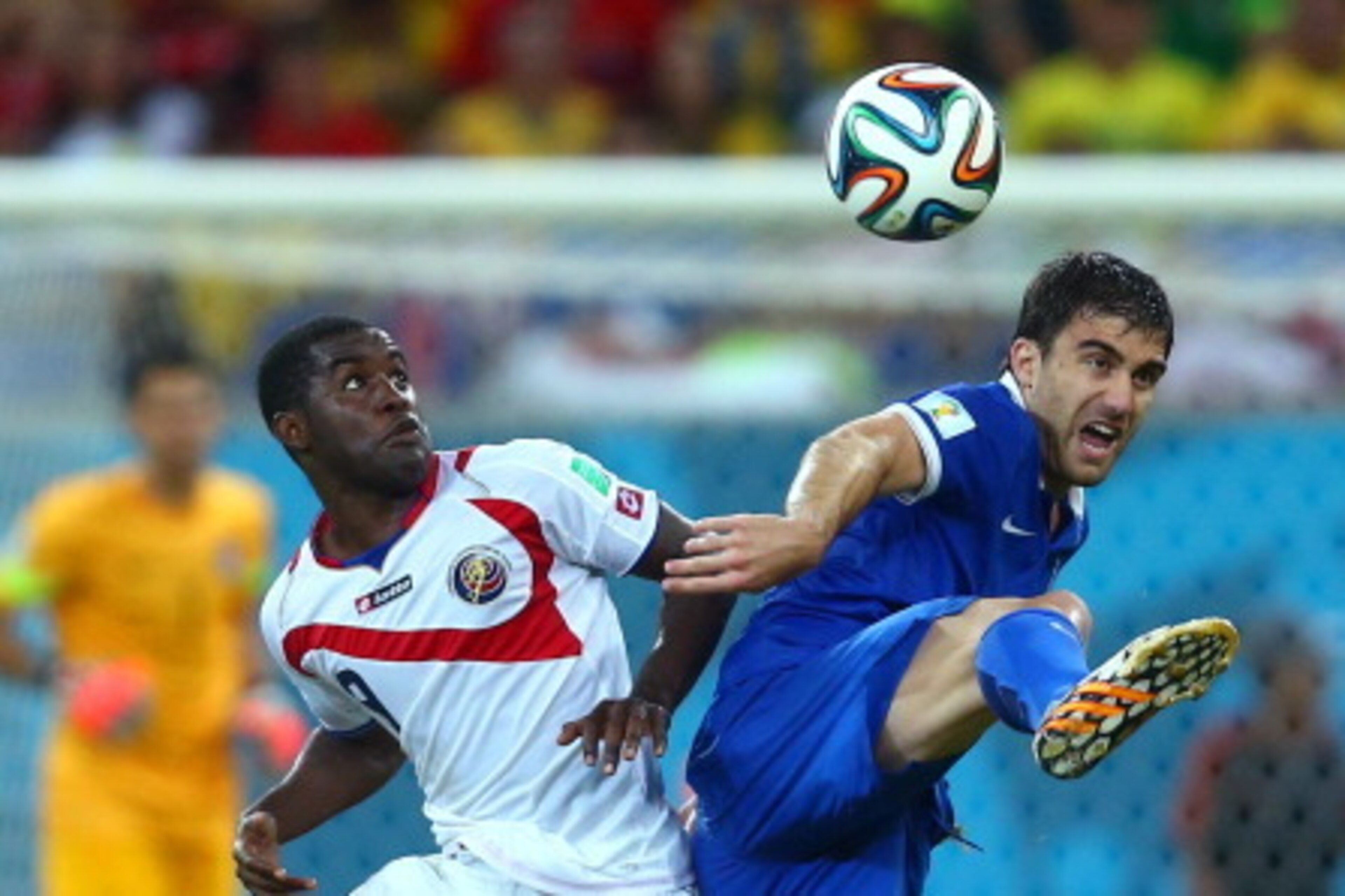 RECIFE, BRAZIL - JUNE 29: Joel Campbell of Costa Rica challenges Sokratis Papastathopoulos of Greece during the 2014 FIFA World Cup Brazil Round of 16 match between Costa Rica and Greece at Arena Pernambuco on June 29, 2014 in Recife, Brazil.  (Photo by J