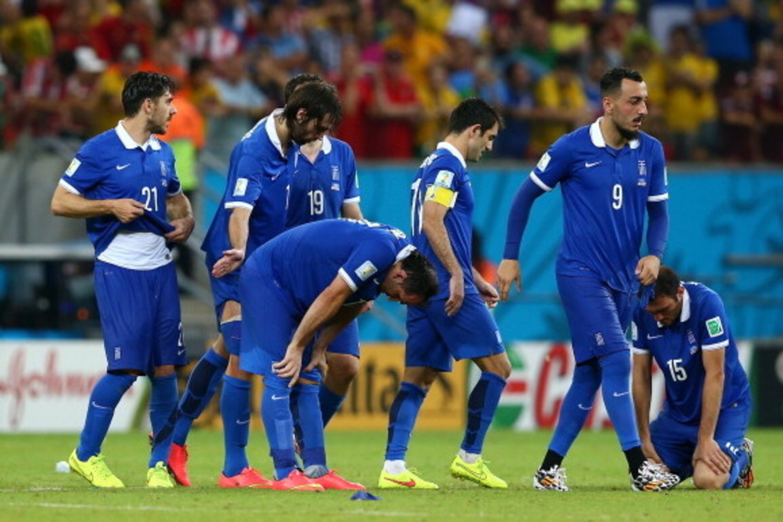 RECIFE, BRAZIL - JUNE 29:  (L-R) Konstantinos Katsouranis, Giorgos Samaras, Sokratis Papastathopoulos, Theofanis Gekas, Giorgos Karagounis, Konstantinos Mitroglou and Vasilis Torosidis of Greece react after being defeated by Costa Rica in a penalty shooto