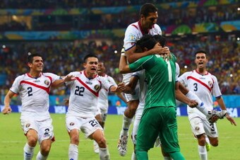 RECIFE, BRAZIL - JUNE 29: Keylor Navas of Costa Rica is swarmed by teammates in celebration after defeating Greece in a penalty shootout during the 2014 FIFA World Cup Brazil Round of 16 match between Costa Rica and Greece at Arena Pernambuco on June 29, RECIFE, BRAZIL - JUNE 29: Keylor Navas of Costa Rica is swarmed by teammates in celebration after defeating Greece in a penalty shootout during the 2014 FIFA World Cup Brazil Round of 16 match between Costa Rica and Greece at Arena Pernambuco on June 29,
