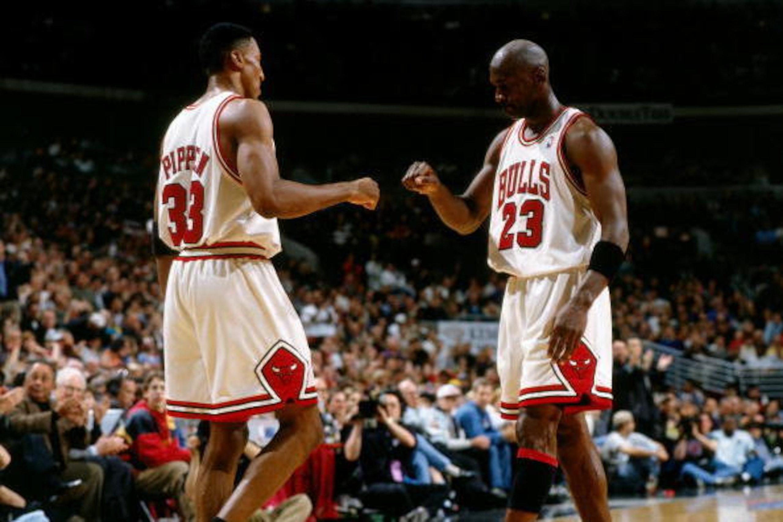 CHICAGO - MAY 3:  Michael Jordan #23 and Scottie Pippen #33 of the Chicago Bulls celebrate during game one of round two of the 1998 NBA Playoffs against the Charlotte Hornets at Chicago Stadium on May 3, 1998 in Chicago, Illinois.  NOTE TO USER:  User exp