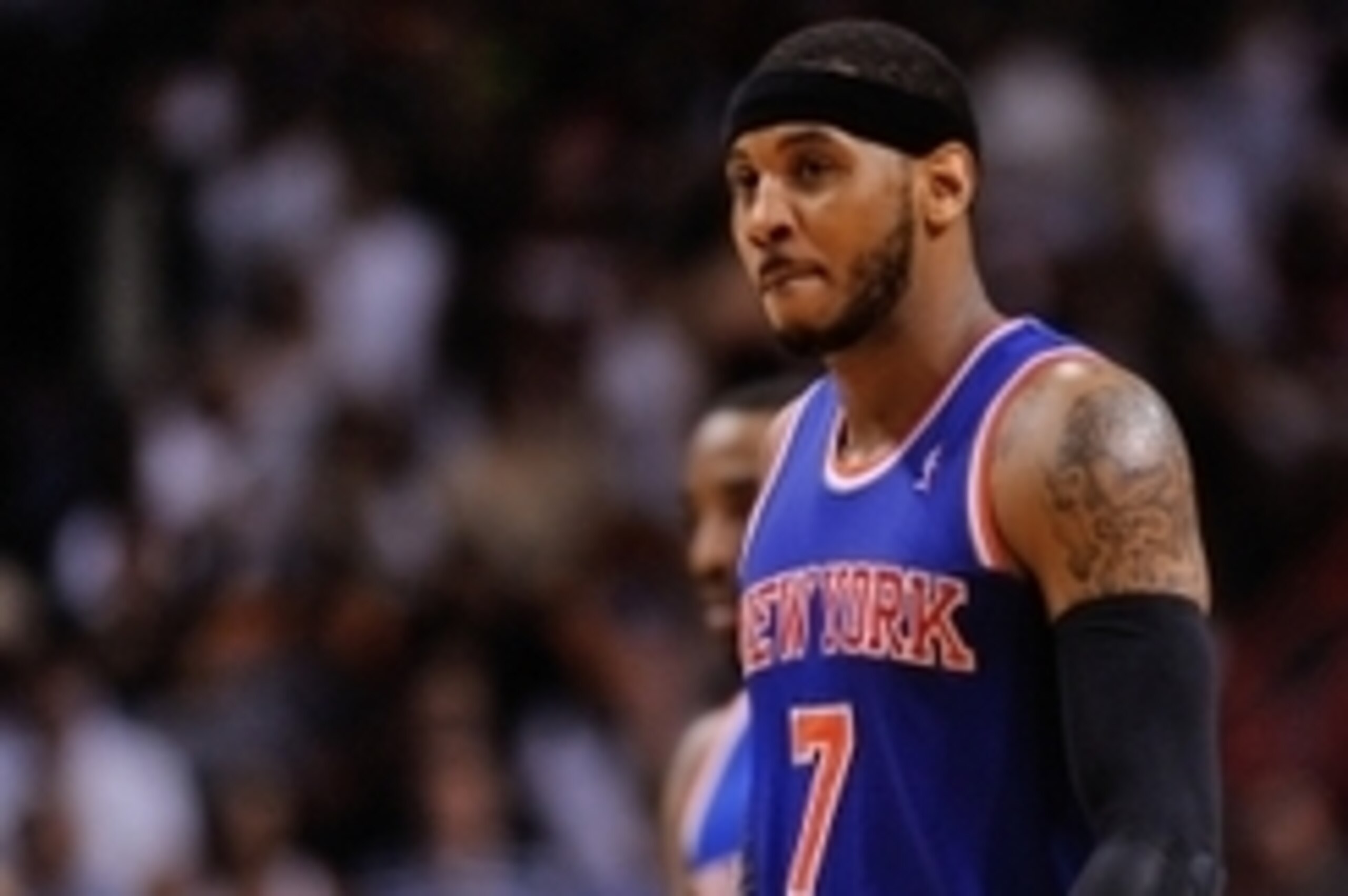 Apr 6, 2014; Miami, FL, USA; New York Knicks forward Carmelo Anthony (7) walks back to the bench during the second half against the Miami Heat at American Airlines Arena. Miami won 102-91. Mandatory Credit: Steve Mitchell-USA TODAY Sports