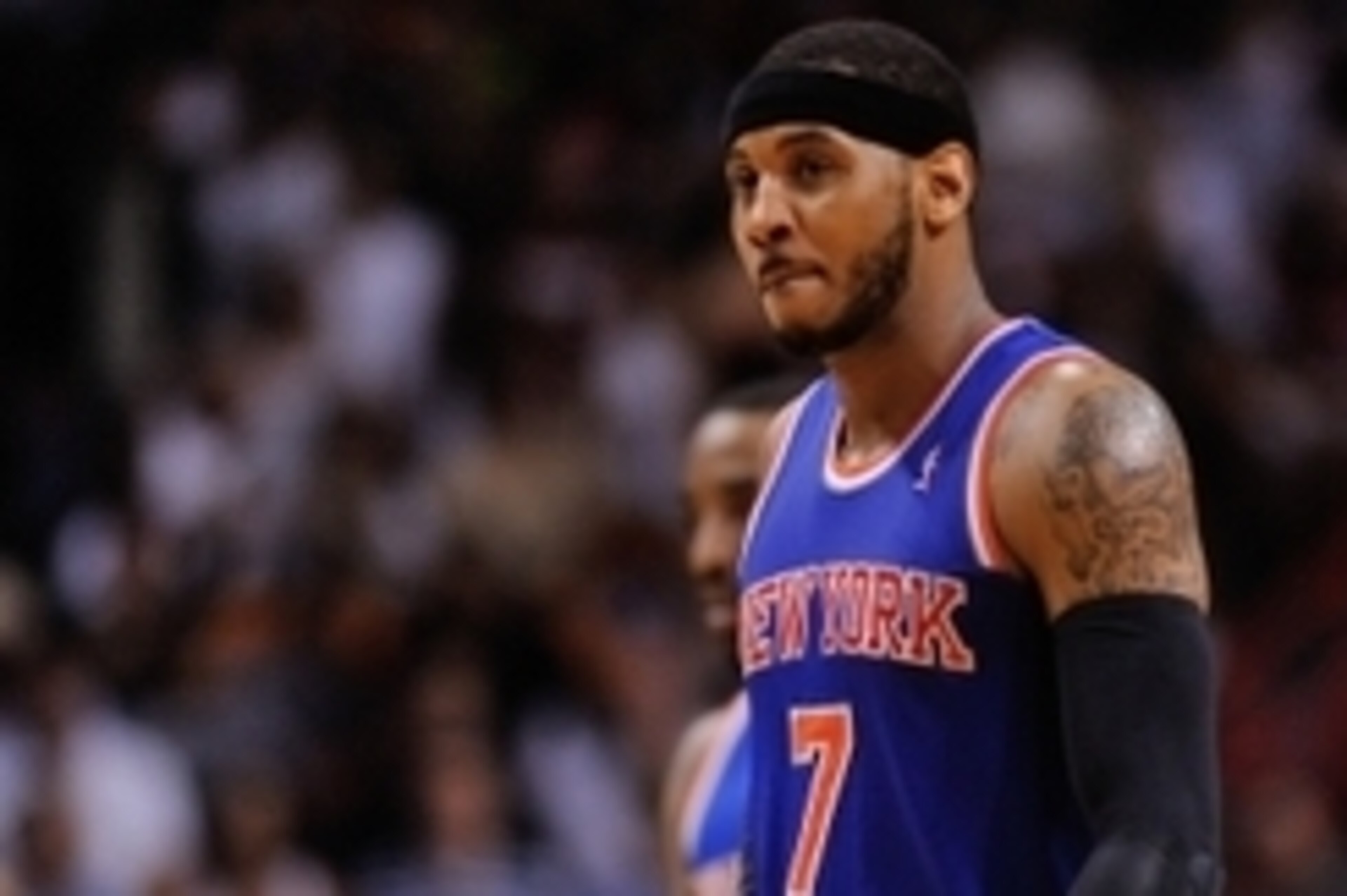 Apr 6, 2014; Miami, FL, USA; New York Knicks forward Carmelo Anthony (7) walks back to the bench during the second half against the Miami Heat at American Airlines Arena. Miami won 102-91. Mandatory Credit: Steve Mitchell-USA TODAY Sports