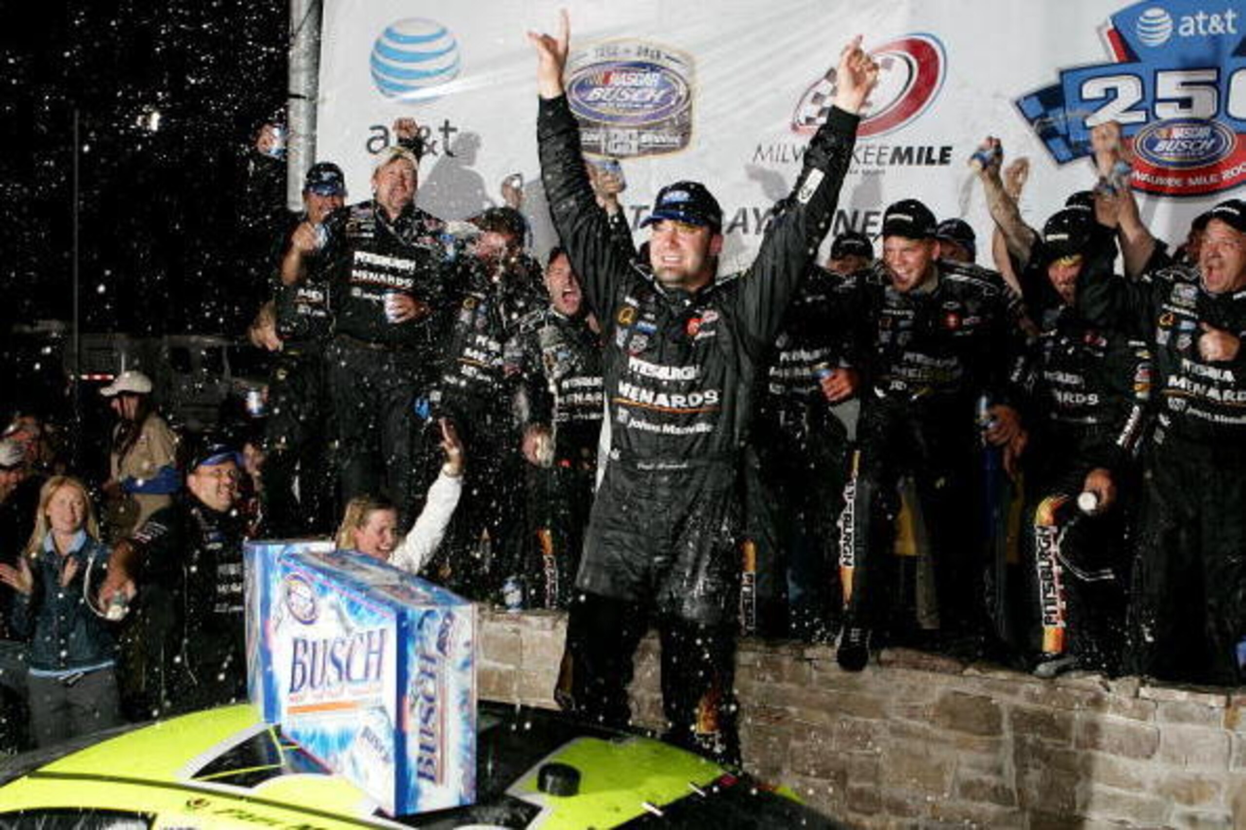 WEST ALLIS, WI - JUNE 24:  Paul Menard and his crew celebrate victory at the AT&T 250 race with a beer shower on June 24, 2006 at the Milwaukee Mile in West Allis, Wisconsin.  (Photo by Jonathan Daniel/Getty Images)