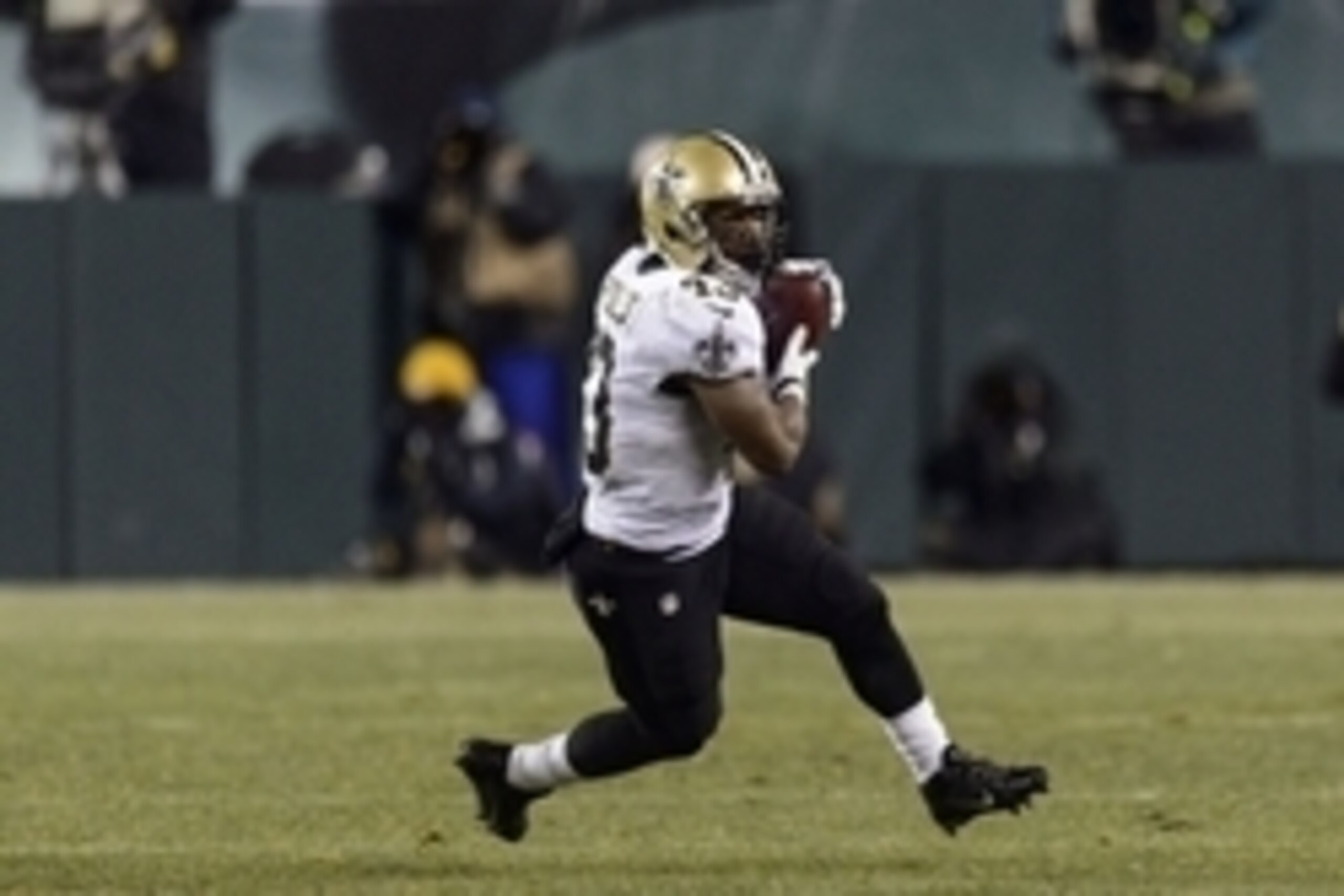 Jan 4, 2014; Philadelphia, PA, USA; New Orleans Saints running back Darren Sproles (43) carries the ball during the fourth quarter against the Philadelphia Eagles during the 2013 NFC wild card playoff football game at Lincoln Financial Field. The Saints d