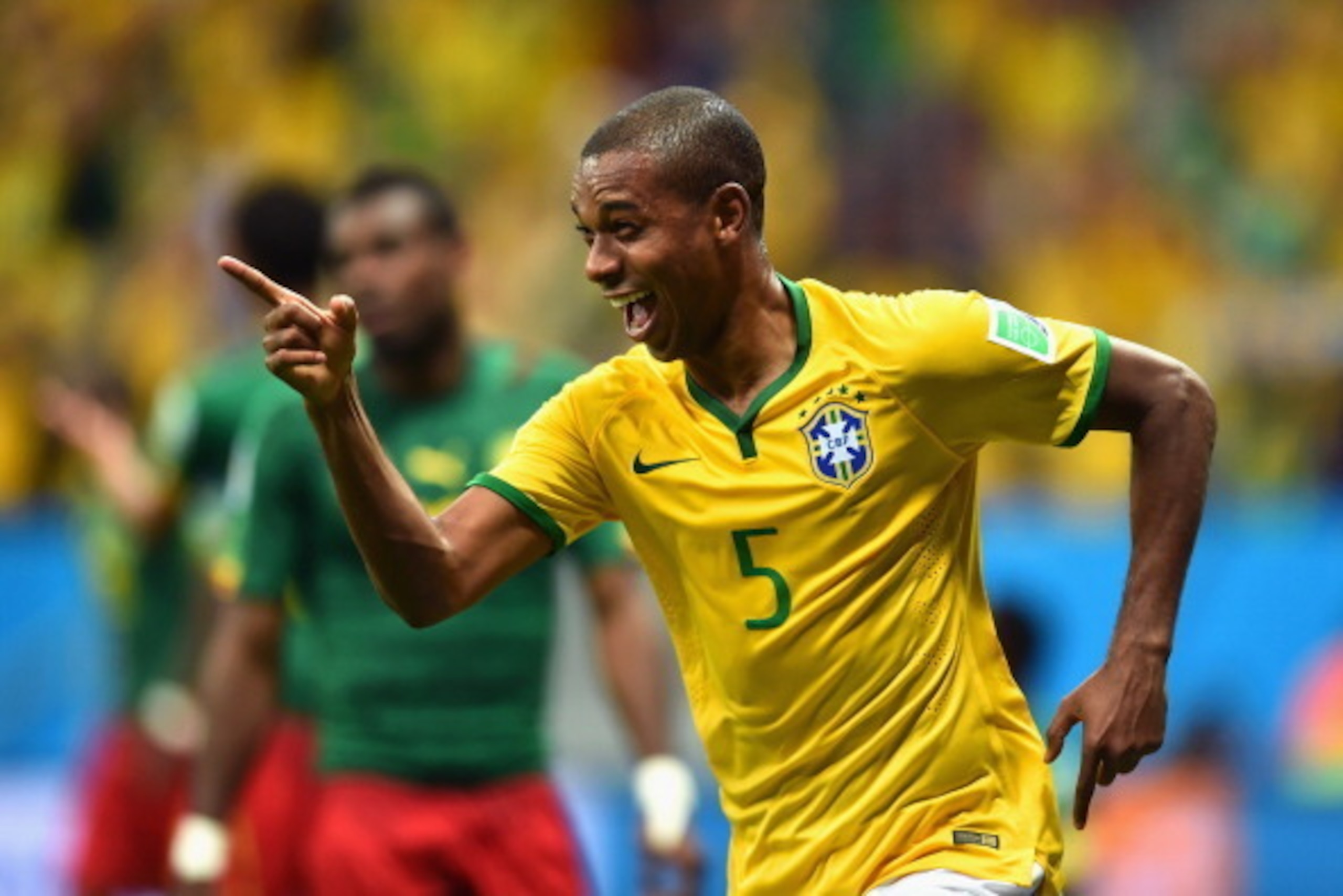 BRASILIA, BRAZIL - JUNE 23: Fernandinho of Brazil celebrates scoring his team's fourth goal during the 2014 FIFA World Cup Brazil Group A match between Cameroon and Brazil at Estadio Nacional on June 23, 2014 in Brasilia, Brazil. (Photo by Buda Mendes/G BRASILIA, BRAZIL - JUNE 23: Fernandinho of Brazil celebrates scoring his team's fourth goal during the 2014 FIFA World Cup Brazil Group A match between Cameroon and Brazil at Estadio Nacional on June 23, 2014 in Brasilia, Brazil. (Photo by Buda Mendes/G