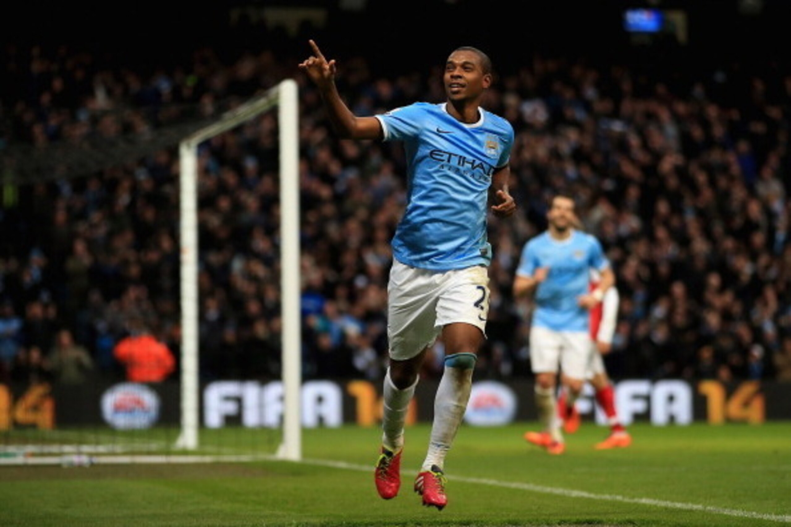 MANCHESTER, ENGLAND - DECEMBER 14: Fernandinho of Manchester City celebrates scoring their fifth goal past Wojciech Szczesny of Arsenal during the Barclays Premier League match between Manchester City and Arsenal at Etihad Stadium on December 14, 2013 in MANCHESTER, ENGLAND - DECEMBER 14: Fernandinho of Manchester City celebrates scoring their fifth goal past Wojciech Szczesny of Arsenal during the Barclays Premier League match between Manchester City and Arsenal at Etihad Stadium on December 14, 2013 in