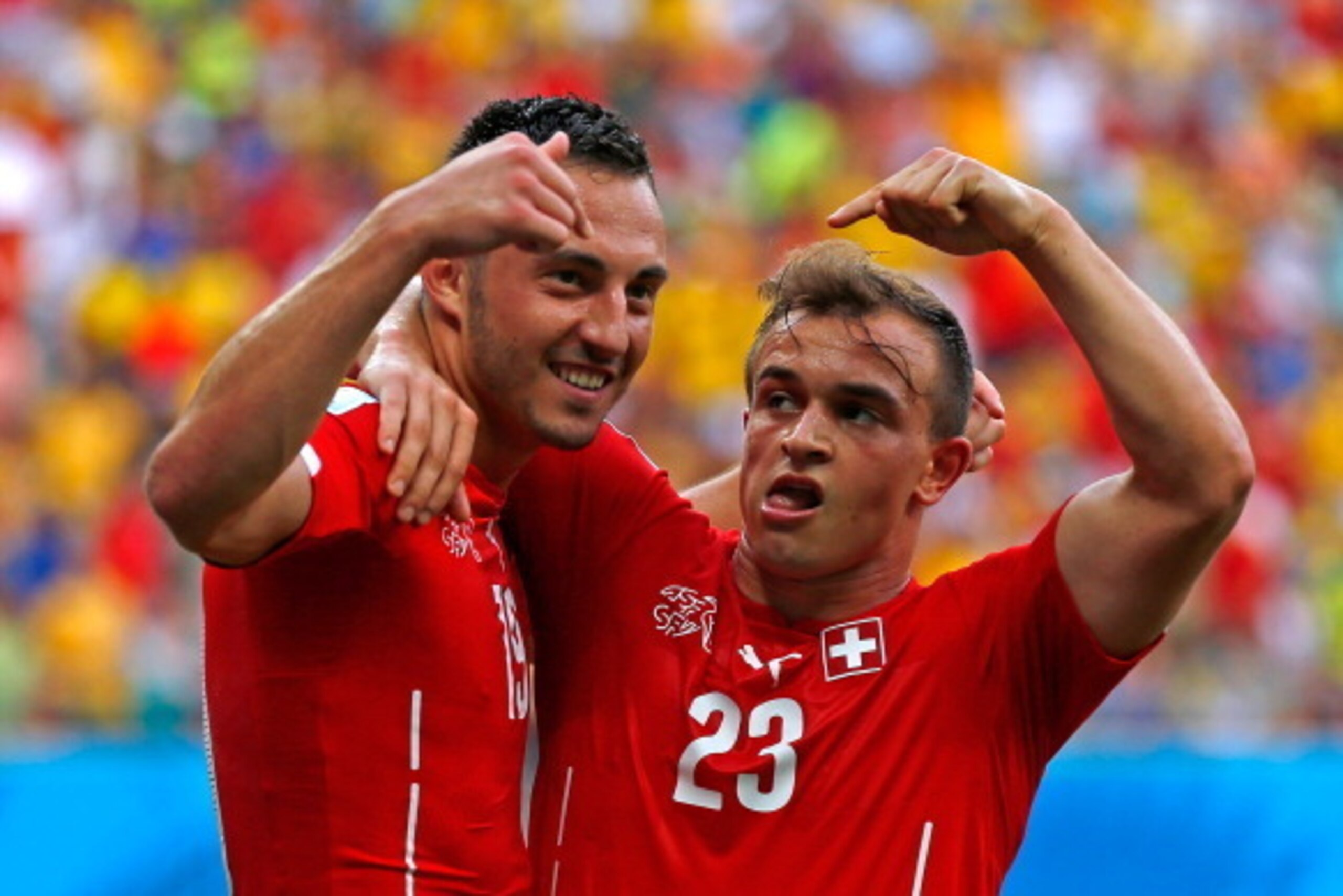 MANAUS, BRAZIL - JUNE 25: Xherdan Shaqiri (R) celebrates scoring his team's second goal with Josip Drmic of Switzerland during the 2014 FIFA World Cup Brazil Group E match between Honduras and Switzerland at Arena Amazonia on June 25, 2014 in Manaus, Bra MANAUS, BRAZIL - JUNE 25: Xherdan Shaqiri (R) celebrates scoring his team's second goal with Josip Drmic of Switzerland during the 2014 FIFA World Cup Brazil Group E match between Honduras and Switzerland at Arena Amazonia on June 25, 2014 in Manaus, Bra
