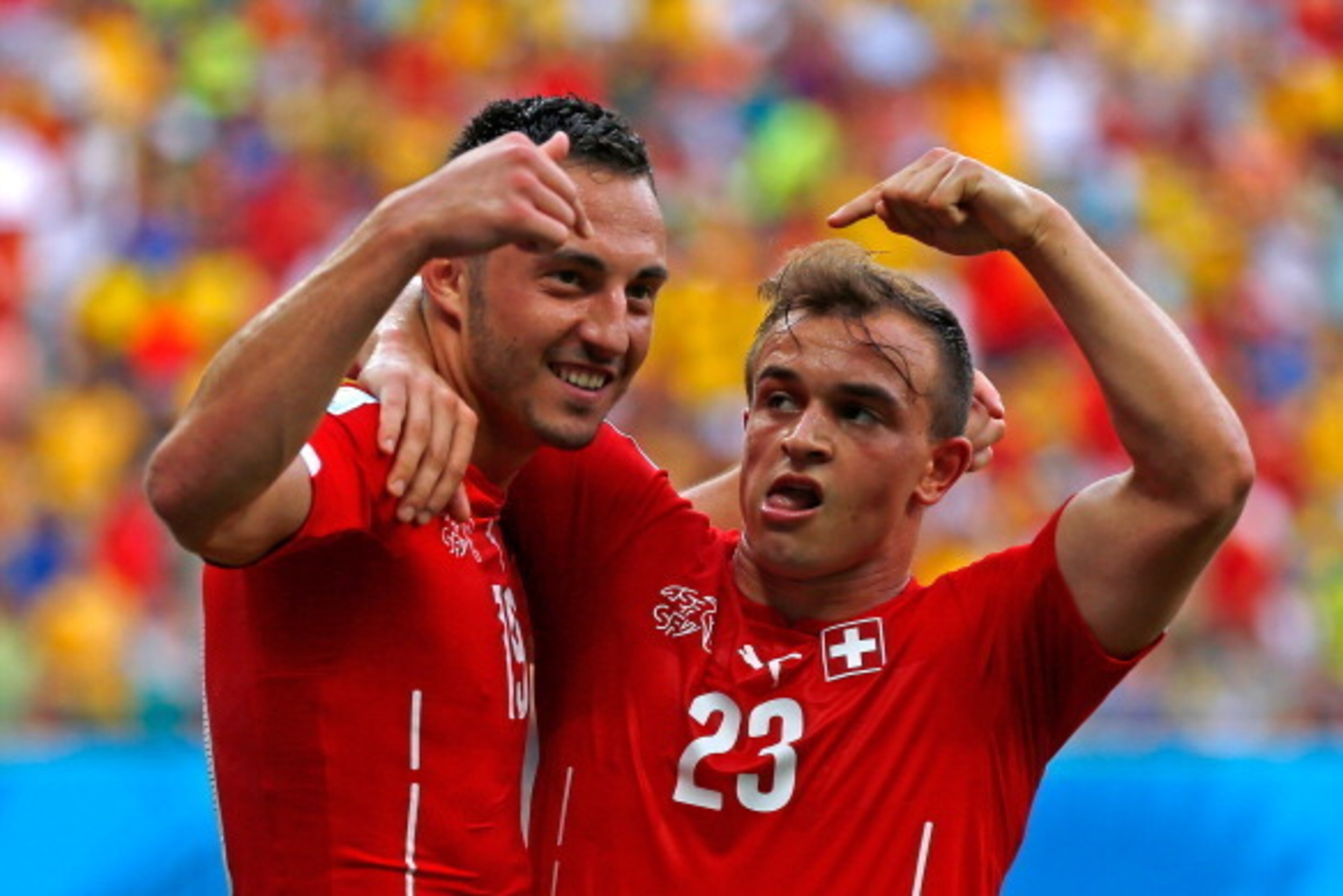 MANAUS, BRAZIL - JUNE 25:  Xherdan Shaqiri (R) celebrates scoring his team's second goal with Josip Drmic of Switzerland during the 2014 FIFA World Cup Brazil Group E match between Honduras and Switzerland at Arena Amazonia on June 25, 2014 in Manaus, Bra