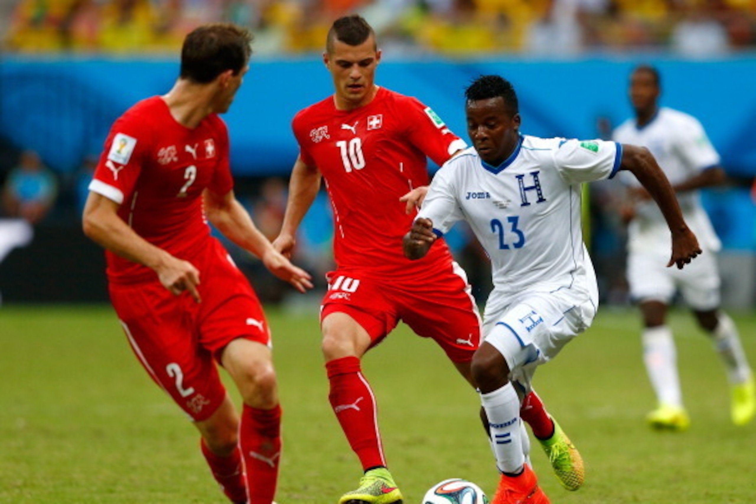 MANAUS, BRAZIL - JUNE 25: Marvin Chavez of Honduras controls the ball as Granit Xhaka of Switzerland gives chase during the 2014 FIFA World Cup Brazil Group E match between Honduras and Switzerland at Arena Amazonia on June 25, 2014 in Manaus, Brazil. ( MANAUS, BRAZIL - JUNE 25: Marvin Chavez of Honduras controls the ball as Granit Xhaka of Switzerland gives chase during the 2014 FIFA World Cup Brazil Group E match between Honduras and Switzerland at Arena Amazonia on June 25, 2014 in Manaus, Brazil. (