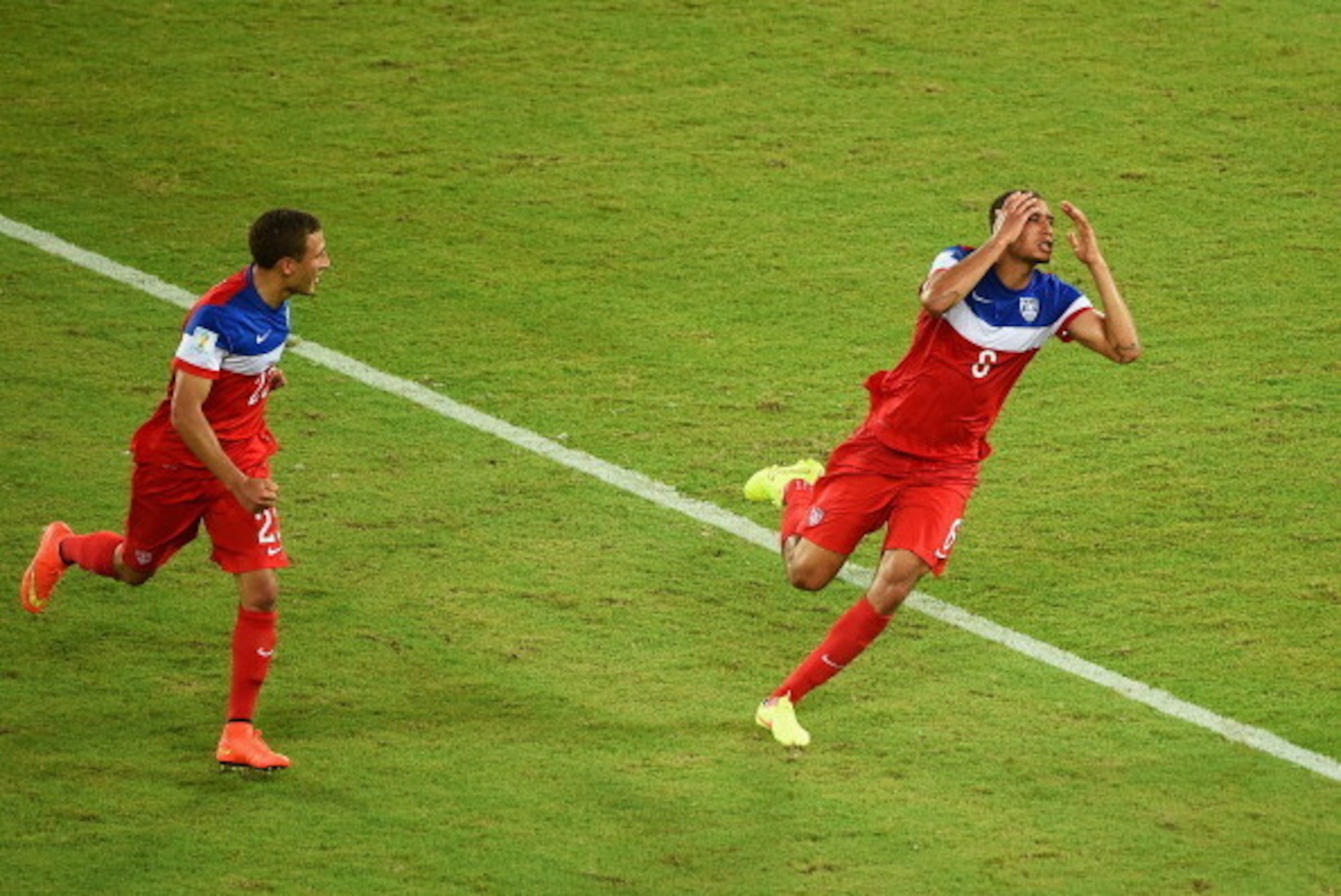 NATAL, BRAZIL - JUNE 16:  John Brooks of the United States (R) celebrates scoring his team's second goal with Fabian Johnson during the 2014 FIFA World Cup Brazil Group G match between Ghana and the United States at Estadio das Dunas on June 16, 2014 in N