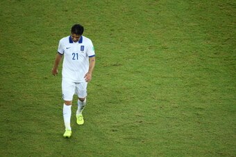 NATAL, BRAZIL - JUNE 19:  Konstantinos Katsouranis of Greece is sent off after being given a second yellow and red card during the 2014 FIFA World Cup Brazil Group  C match between Japan and Greece at Estadio das Dunas on June 19, 2014 in Natal, Brazil.  