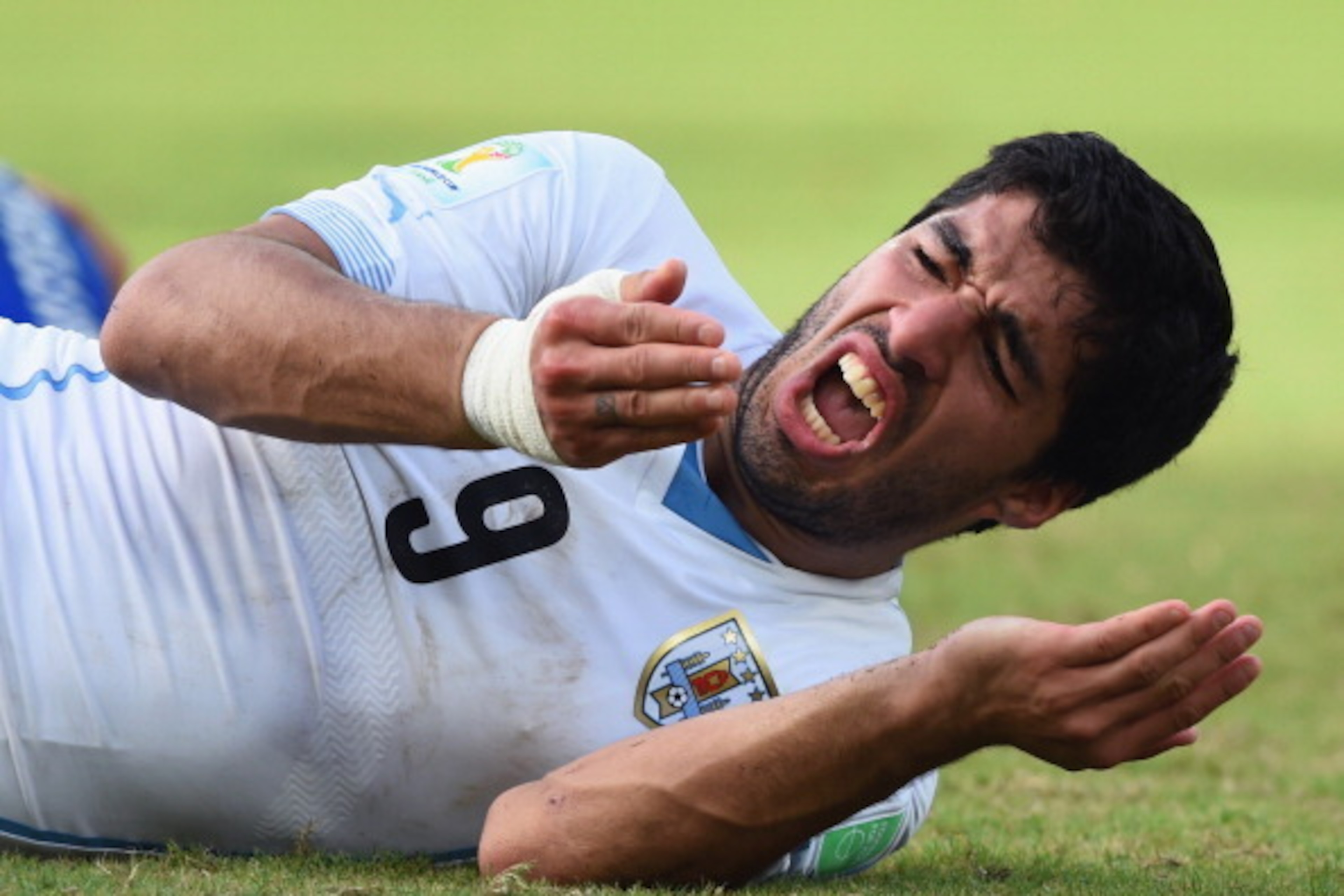 NATAL, BRAZIL - JUNE 24: Luis Suarez of Uruguay reacts during the 2014 FIFA World Cup Brazil Group D match between Italy and Uruguay at Estadio das Dunas on June 24, 2014 in Natal, Brazil. (Photo by Matthias Hangst/Getty Images) NATAL, BRAZIL - JUNE 24: Luis Suarez of Uruguay reacts during the 2014 FIFA World Cup Brazil Group D match between Italy and Uruguay at Estadio das Dunas on June 24, 2014 in Natal, Brazil. (Photo by Matthias Hangst/Getty Images)