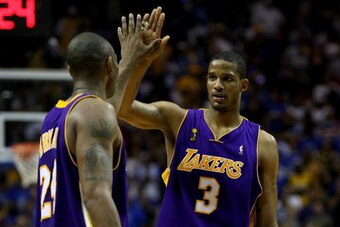 ORLANDO, FL - JUNE 14:  Kobe Bryant #24 and Trevor Ariza #3 of the Los Angeles Lakers high five in the final moments of the Lakers' win over the Orlando Magic in Game Five of the 2009 NBA Finals on June 14, 2009 at Amway Arena in Orlando, Florida.  NOTE T