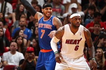 MIAMI, FL - APRIL 6: LeBron James #6 of the Miami Heat defends Carmelo Anthony #7 of the New York Knicks as he calls for the ball during a game on April 6, 2014 at American Airlines Arena in Miami, Florida.  NOTE TO USER: User expressly acknowledges and a