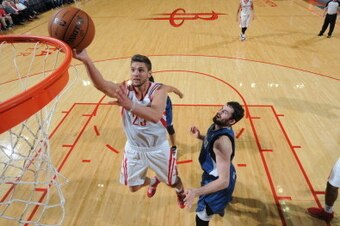 HOUSTON, TX - NOVEMBER 23:  Chandler Parsons #25 of the Houston Rockets shoots the ball against Kevin Love #42 of the Minnesota Timberwolves on November 23, 2013 at the Toyota Center in Houston, Texas. NOTE TO USER: User expressly acknowledges and agrees 