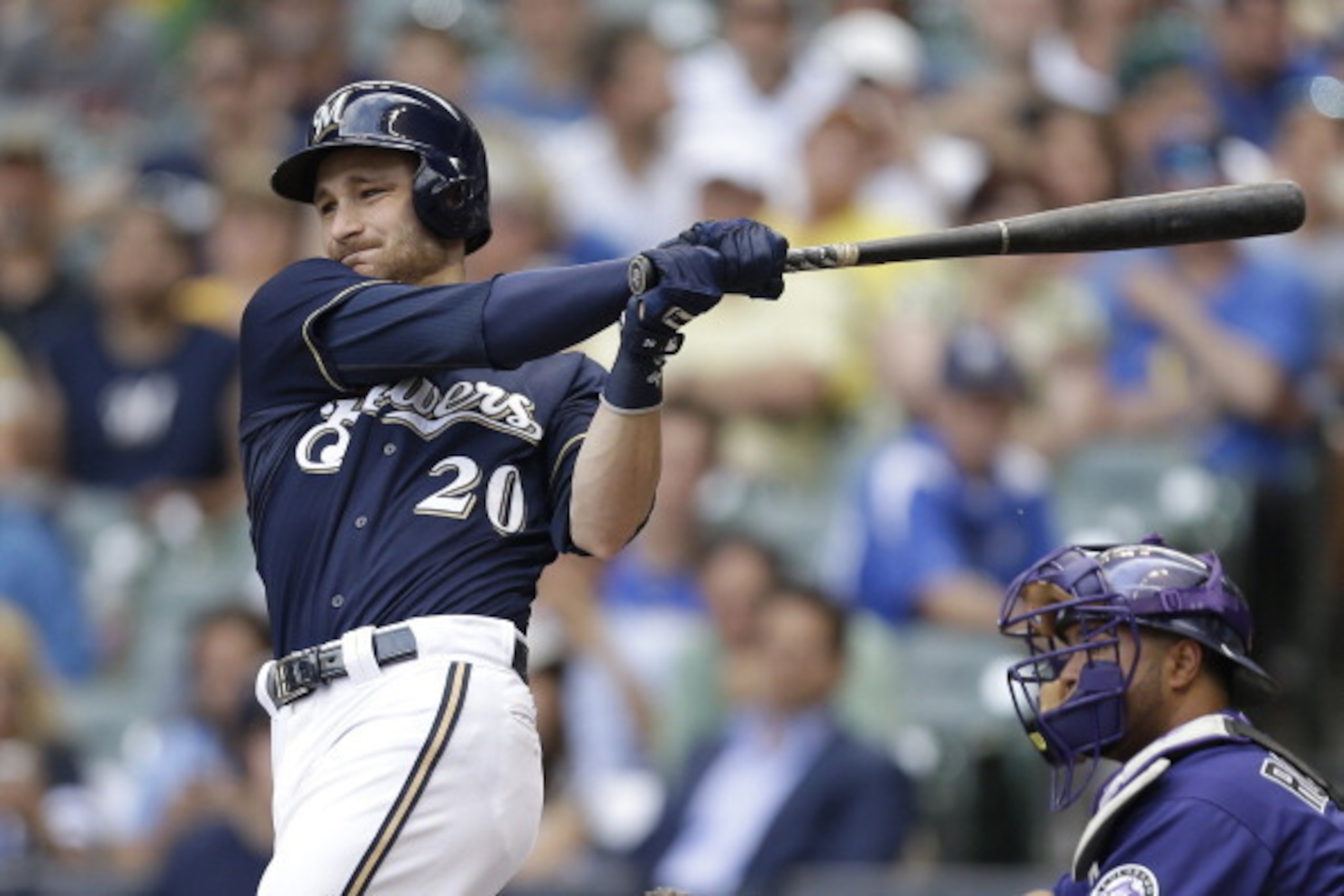 MILWAUKEE, WI - JUNE 28: Jonathan Lucroy #20 of the Milwaukee Brewers hits a single in the top of the first inning against the Colorado Rockies at Miller Park on June 28, 2014 in Milwaukee, Wisconsin. (Photo by Mike McGinnis/Getty Images)