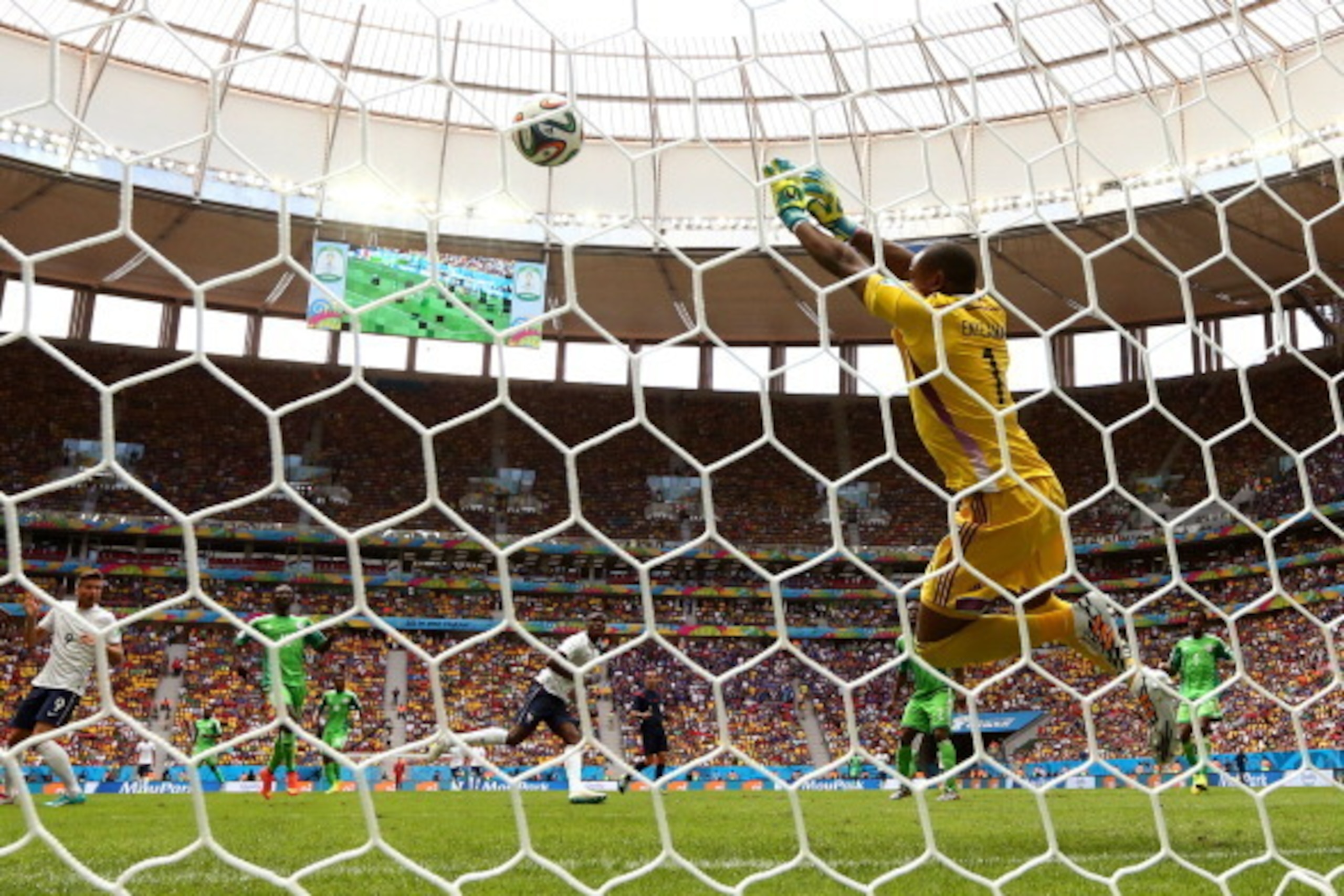 BRASILIA, BRAZIL - JUNE 30: Vincent Enyeama of Nigeria saves a shot by Paul Pogba of France during the 2014 FIFA World Cup Brazil Round of 16 match between France and Nigeria at Estadio Nacional on June 30, 2014 in Brasilia, Brazil.  (Photo by Quinn Roone