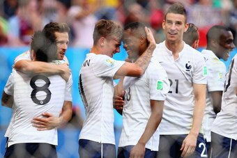 BRASILIA, BRAZIL - JUNE 30: Antoine Griezmann and Patrice Evra of France celebrate after his team's second goal on an own goal by Joseph Yobo of Nigeria (not pictured) during the 2014 FIFA World Cup Brazil Round of 16 match between France and Nigeria at E