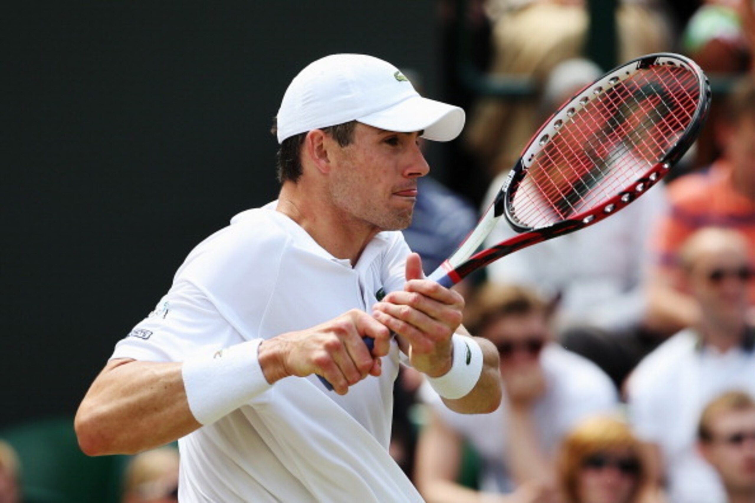 LONDON, ENGLAND - JUNE 30: John Isner of the United States during his Gentlemen's Singles third round match against Feliciano Lopez of Spain on day seven of the Wimbledon Lawn Tennis Championships at the All England Lawn Tennis and Croquet Club on June 3 LONDON, ENGLAND - JUNE 30: John Isner of the United States during his Gentlemen's Singles third round match against Feliciano Lopez of Spain on day seven of the Wimbledon Lawn Tennis Championships at the All England Lawn Tennis and Croquet Club on June 3