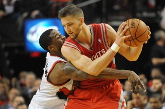 PORTLAND, OR - APRIL  27: Wesley Matthews #2 of the Portland Trail Blazers reaches in on Chandler Parsons #25 of the Houston Rockets in the fourth quarter of Game Four of the Western Conference Quarterfinals during the 2014 NBA Playoffs at the Moda Center
