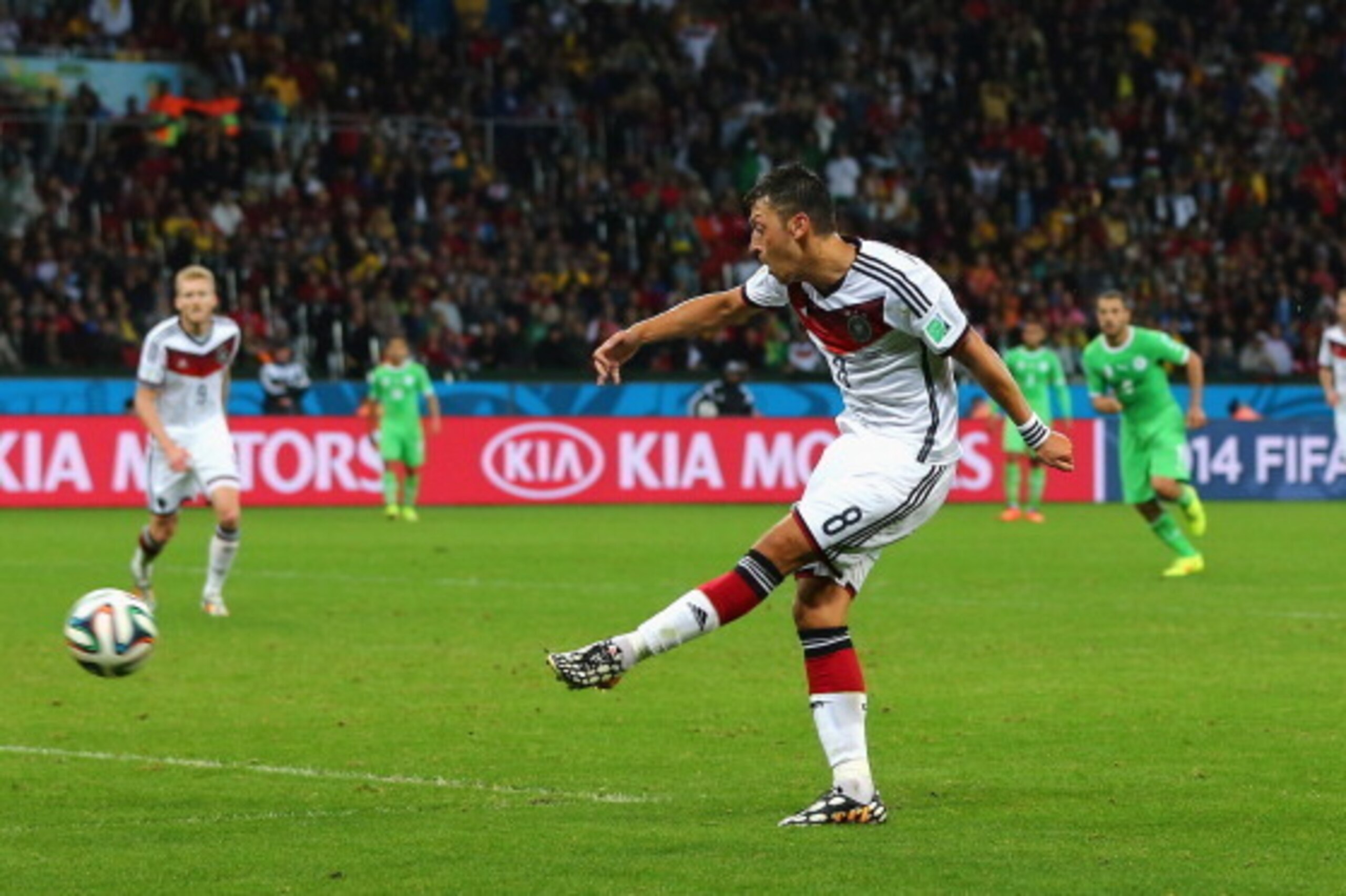 PORTO ALEGRE, BRAZIL - JUNE 30: Mesut Oezil of Germany scores his team's second goal in extra time during the 2014 FIFA World Cup Brazil Round of 16 match between Germany and Algeria at Estadio Beira-Rio on June 30, 2014 in Porto Alegre, Brazil.  (Photo b