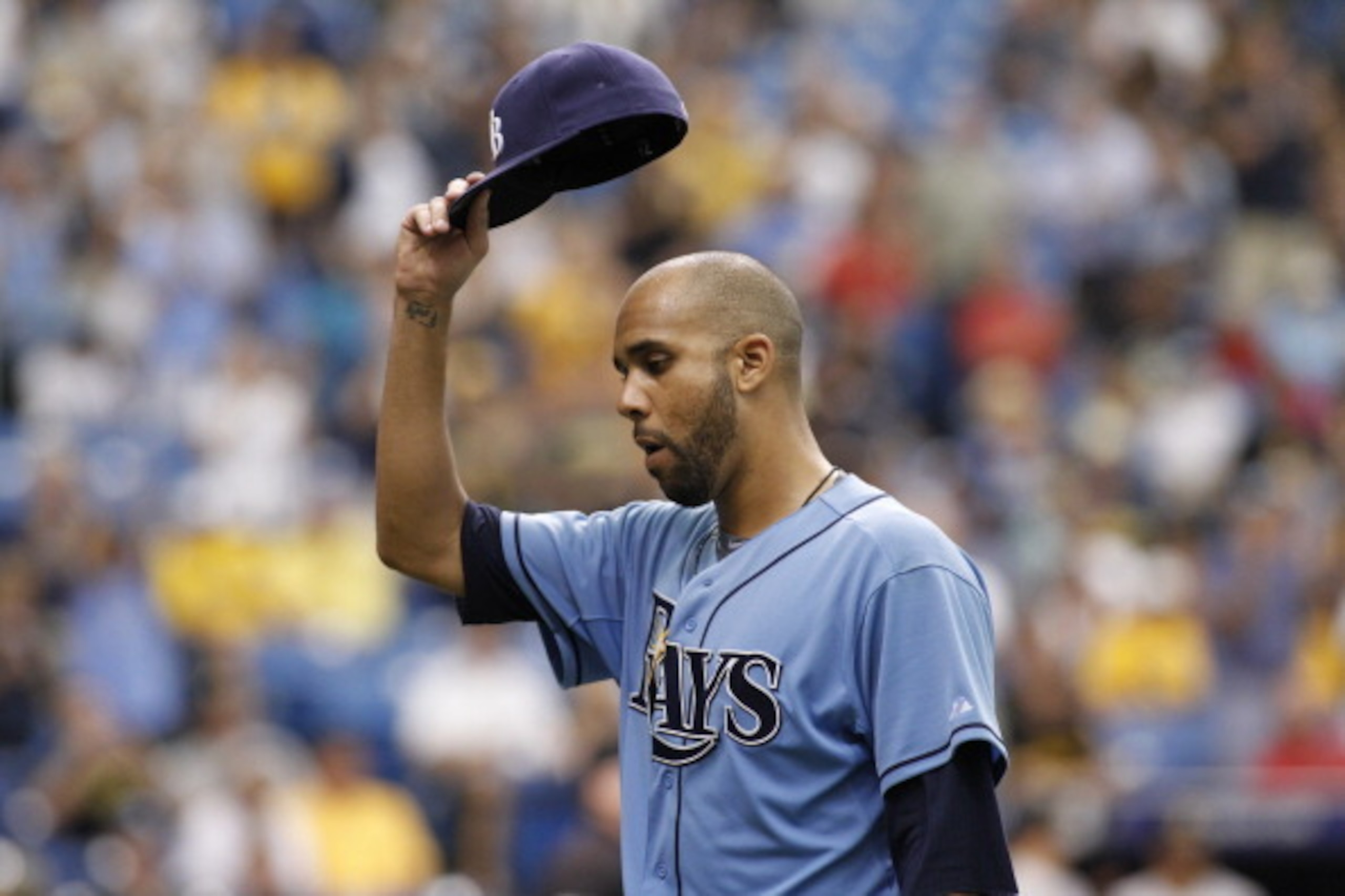 ST. PETERSBURG, FL - JUNE 25:  Pitcher David Price #14 of the Tampa Bay Rays lifts his hat to the crowd as he comes off the mound after giving up a solo home run to Andrew McCutchen #22 of the Pittsburgh Pirates during the ninth inning of a game on June 2