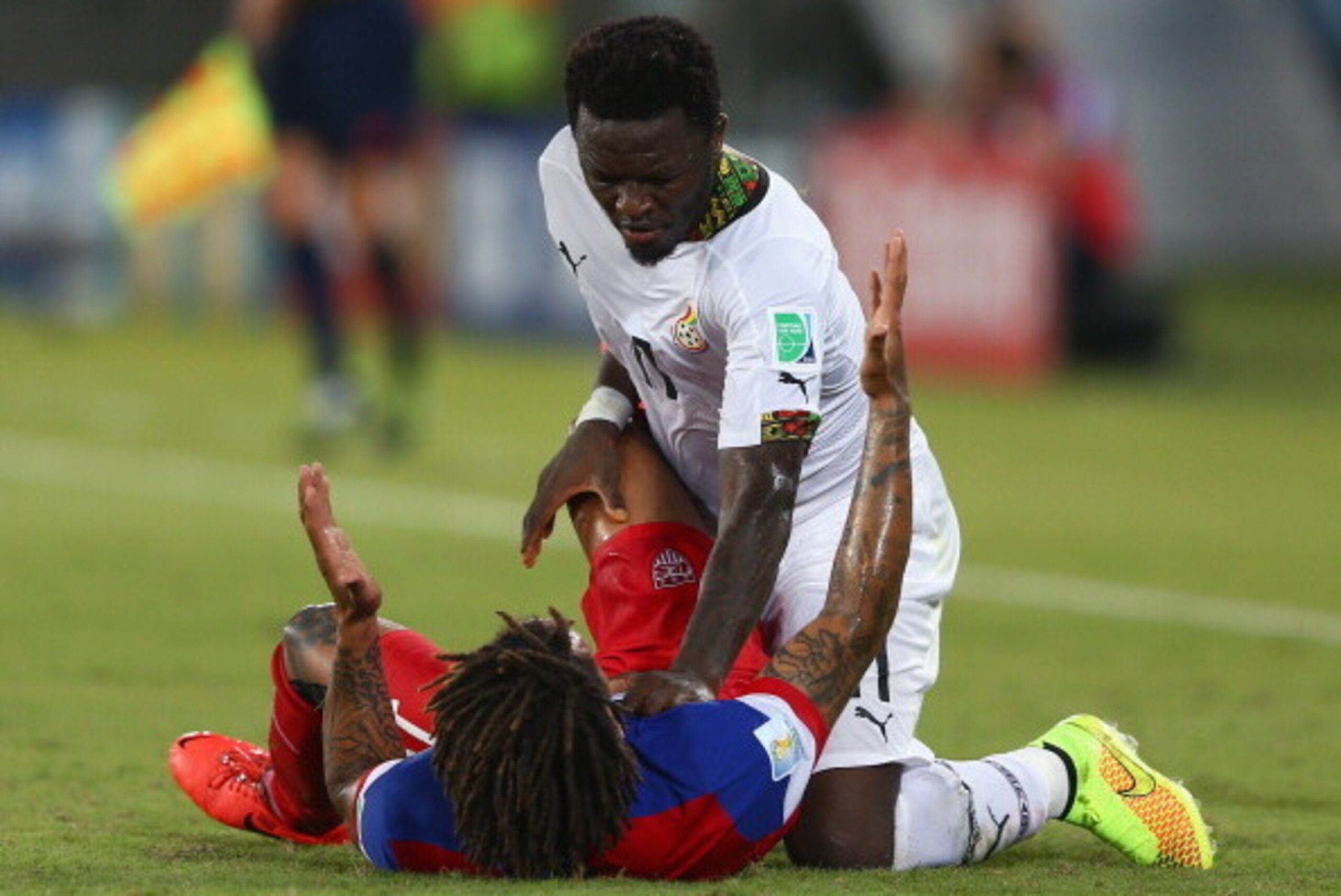 NATAL, BRAZIL - JUNE 16:  Sulley Muntari of Ghana reacts angrily after a challenge by Jermaine Jones of the United States during the 2014 FIFA World Cup Brazil Group G match between Ghana and the United States at Estadio das Dunas on June 16, 2014 in Nata