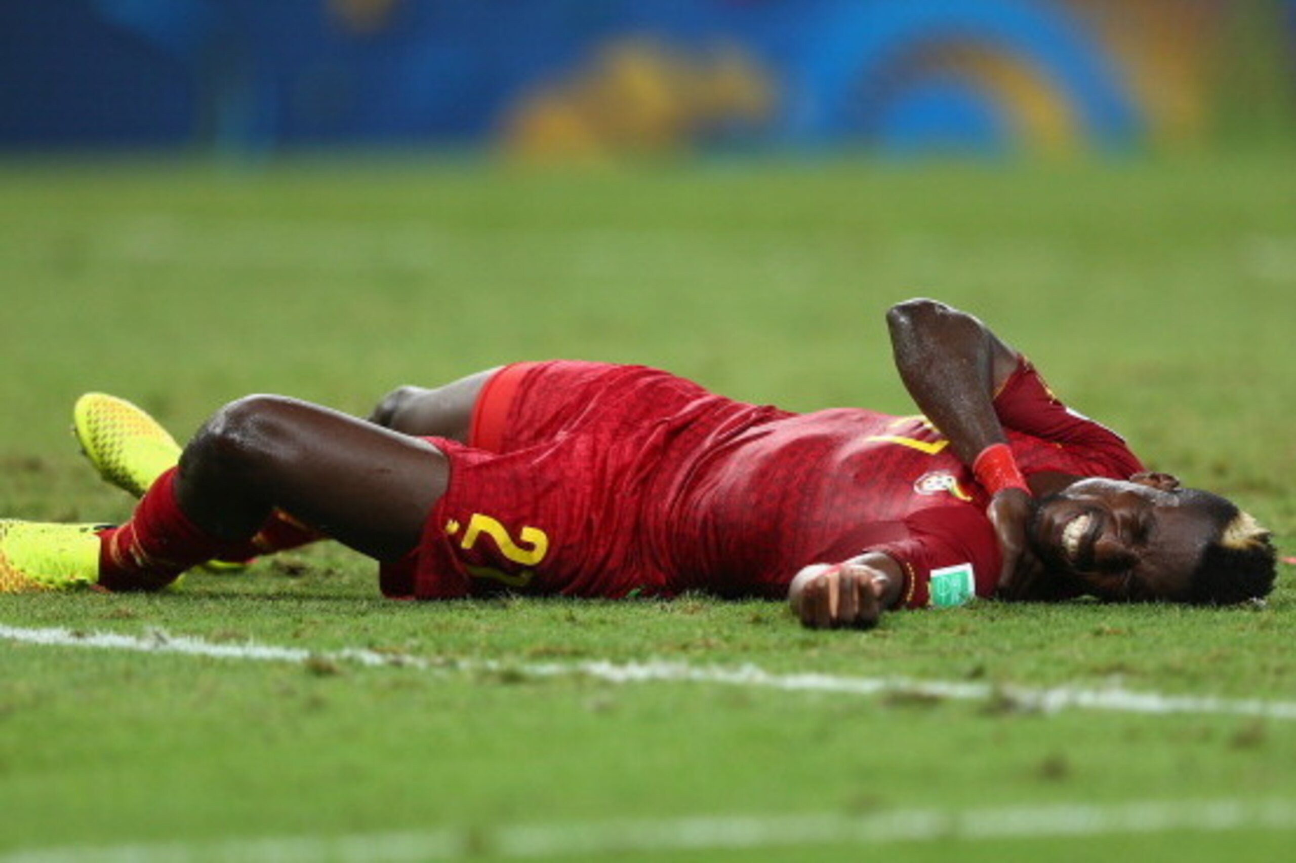 FORTALEZA, BRAZIL - JUNE 21: John Boye of Ghana lies on the field injured after a collision during the 2014 FIFA World Cup Brazil Group G match between Germany and Ghana at Castelao on June 21, 2014 in Fortaleza, Brazil.  (Photo by Michael Steele/Getty Im