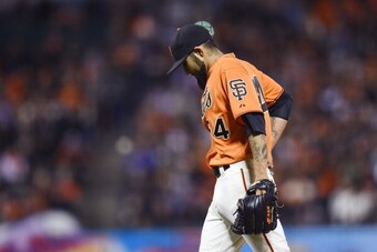 SAN FRANCISCO, CA - JUNE 13:  Sergio Romo #54 of the San Francisco Giants walks back towards the dugout after he was taken out of the game in the top of the ninth inning against the Colorado Rockies at AT&T Park on June 13, 2014 in San Francisco, Californ