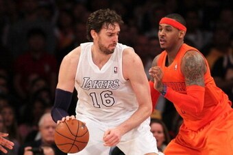 LOS ANGELES, CA - DECEMBER 25:  Pau Gasol #16 of the Los Angeles Lakers posts up Carmelo Anthony #7 of the New York Knicks during the NBA game at Staples Center on December 25, 2012 in Los Angeles, California. The Lakers defeated the Knicks 100-94.  NOTE 