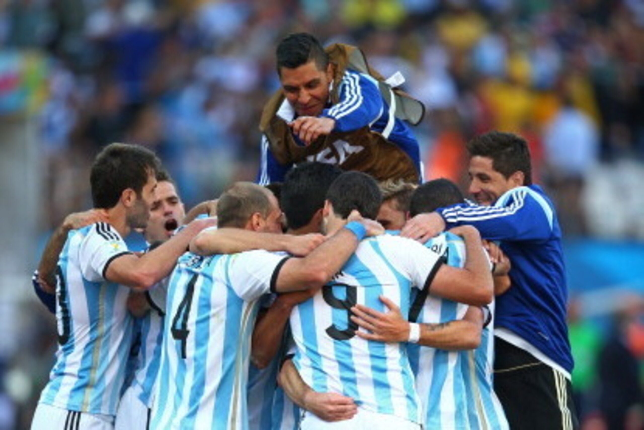 SAO PAULO, BRAZIL - JULY 01:  Angel di Maria of Argentina celebrates scoring his team's first goal in extra time with teammates during the 2014 FIFA World Cup Brazil Round of 16 match between Argentina and Switzerland at Arena de Sao Paulo on July 1, 2014