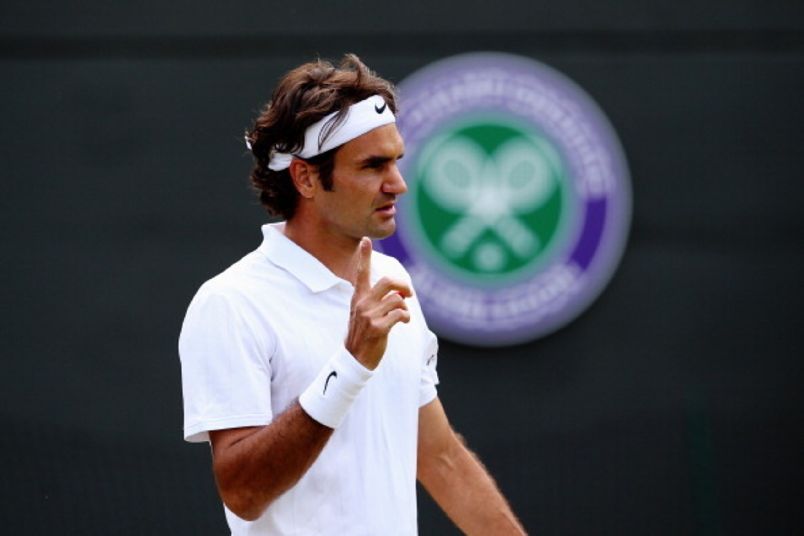 LONDON, ENGLAND - JULY 01:  Roger Federer of Switzerland during his Gentlemen's Singles fourth round match against Tommy Robredo of Spain on day eight of the Wimbledon Lawn Tennis Championships at the All England Lawn Tennis and Croquet Club on July 1, 20