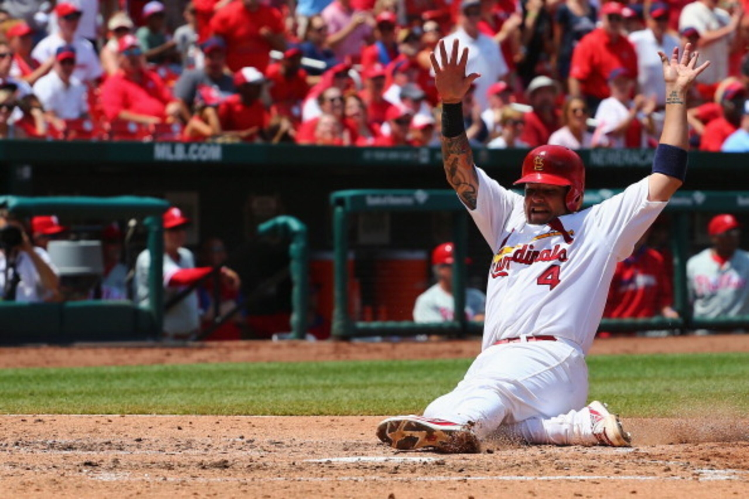ST. LOUIS, MO - JUNE 22: Yadier Molina #4 of the St. Louis Cardinals scores a run in the fourth inning against the Philadelphia Phillies at Busch Stadium on June 22, 2014 in St. Louis, Missouri.  The Cardinals beat the Phillies 5-3.  (Photo by Dilip Vishw