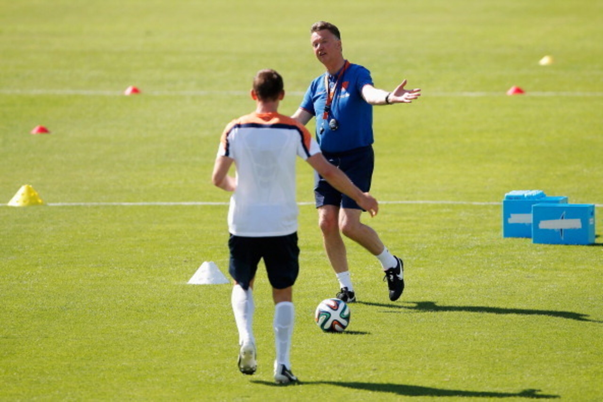 RIO DE JANEIRO, BRAZIL - JUNE 08:  Louis van Gaal, Netherlands national football team manager, speaks to Stefan de Vrij during the Netherlands training session at the 2014 FIFA World Cup Brazil held at the Estadio Jose Bastos Padilha Gavea on June 8, 2014